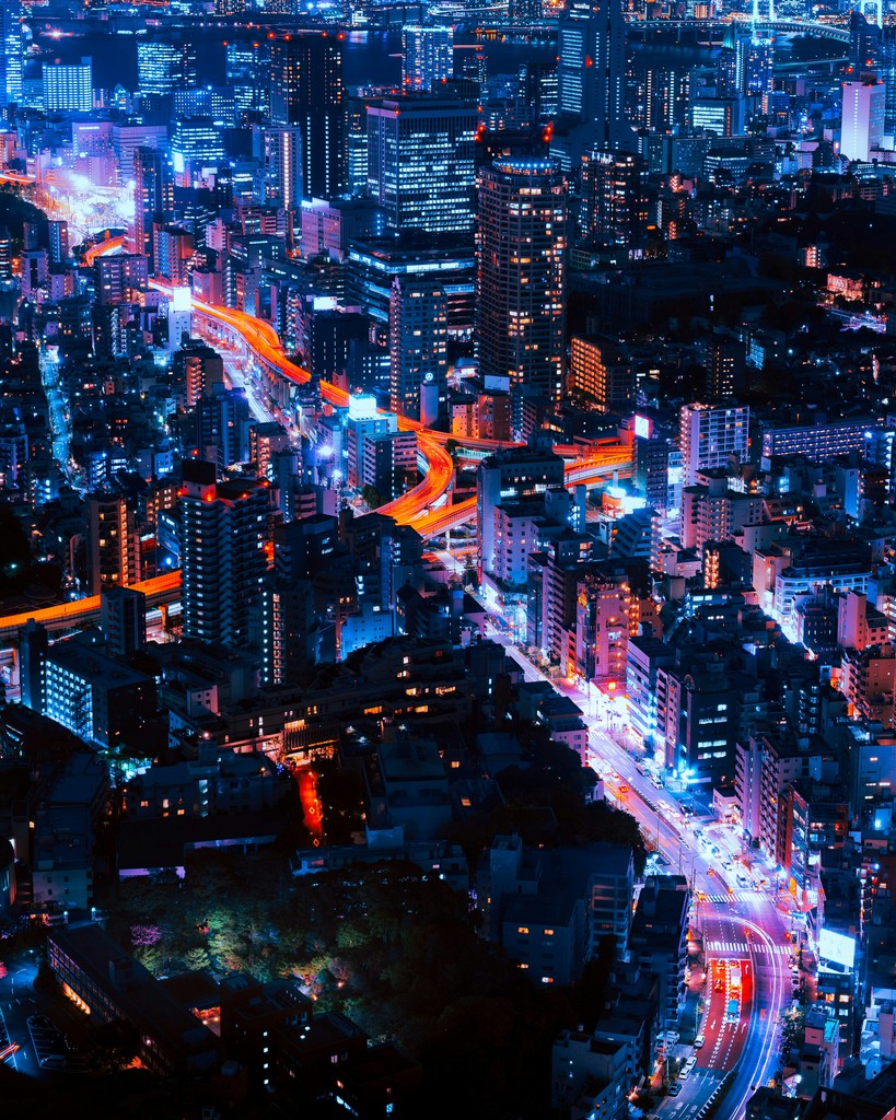 A vibrant city at night as seen from above