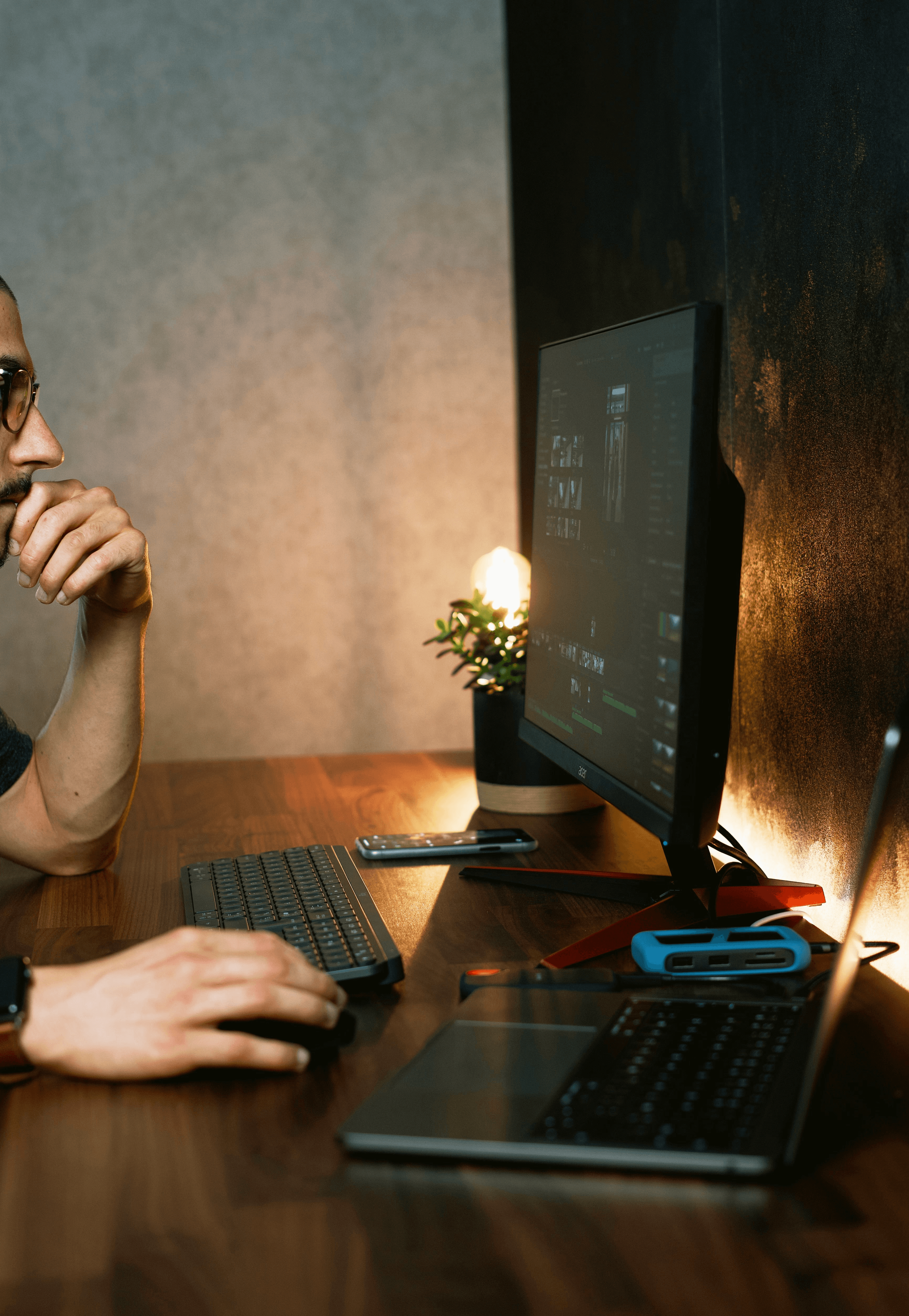 man in gray crew neck t-shirt using computer