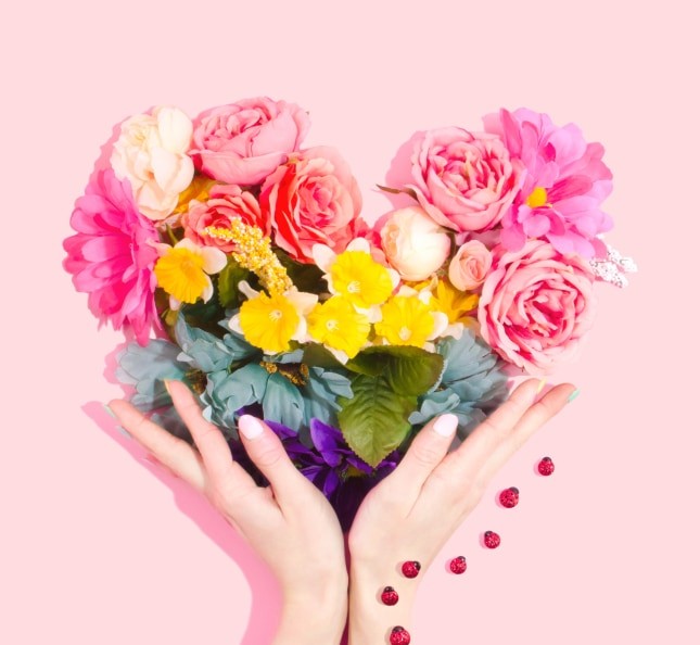 Flowers for Mothers day with hands holding
