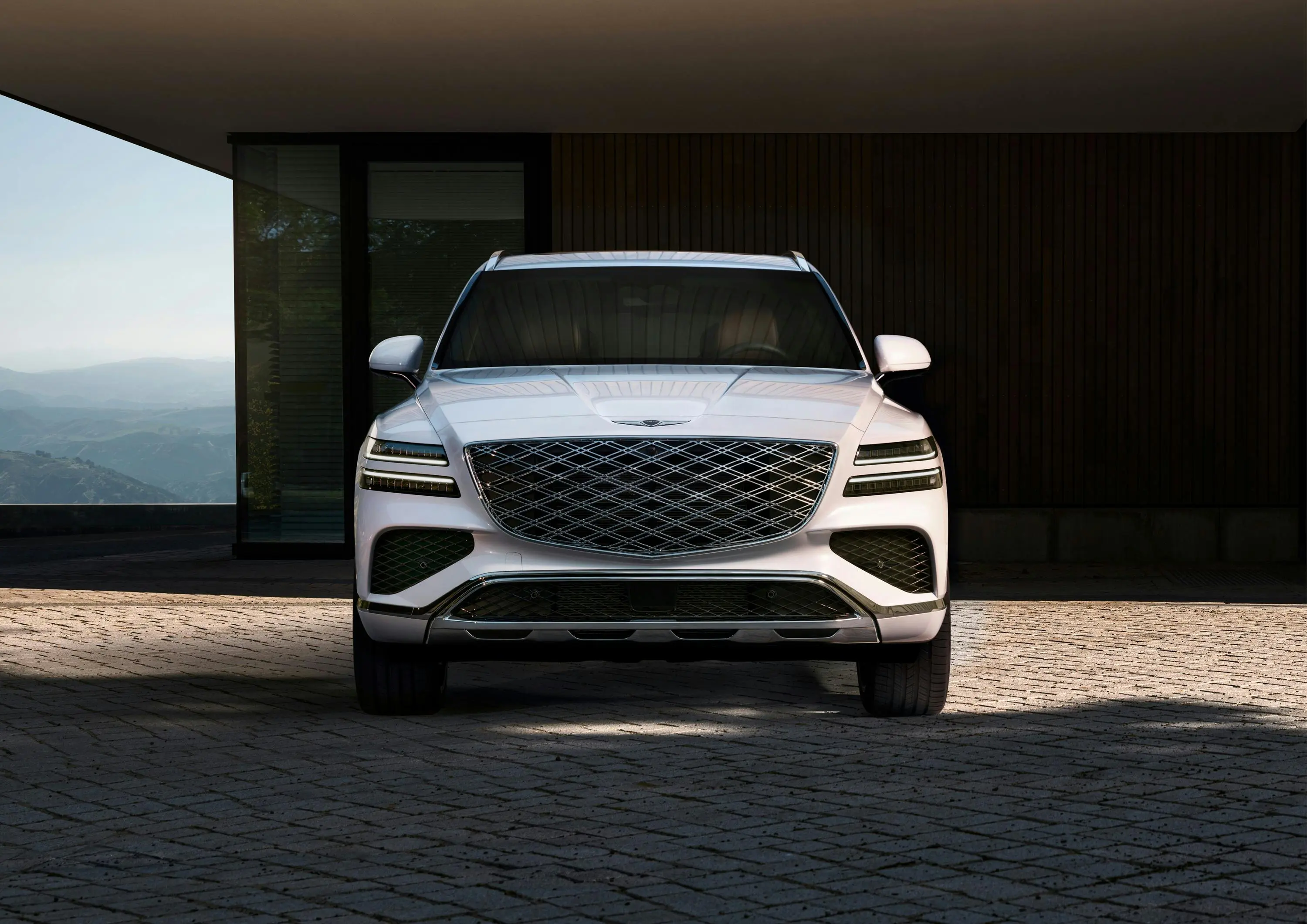 Modern SUV parked in front of a minimalist building, used as a cover image for a car dealership website article