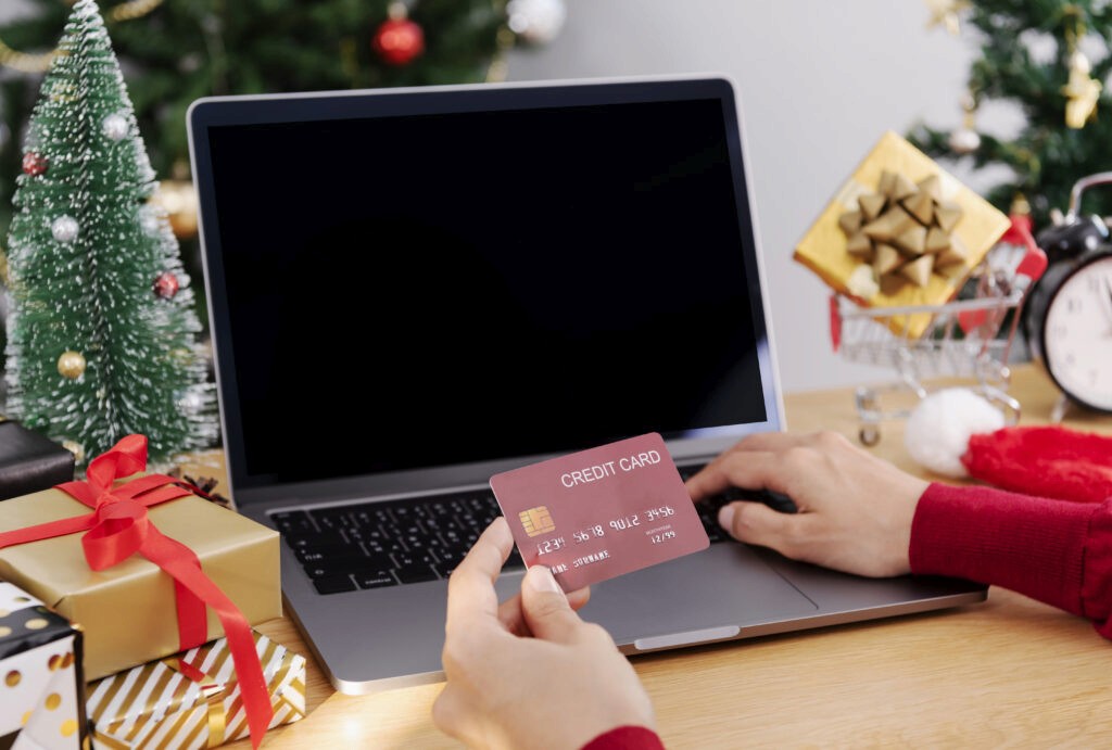 woman holding credit card doing online shopping pr 2024 12 06 19 15 14 utc