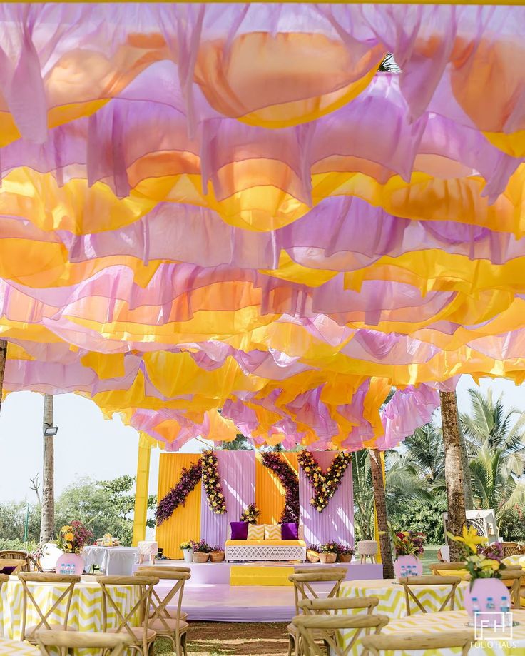 Outdoor Haldi decoration with purple yellow drapes & flowers, perfect terrace decor in Vasundhara, Ghaziabad, Dwarka & Saket
