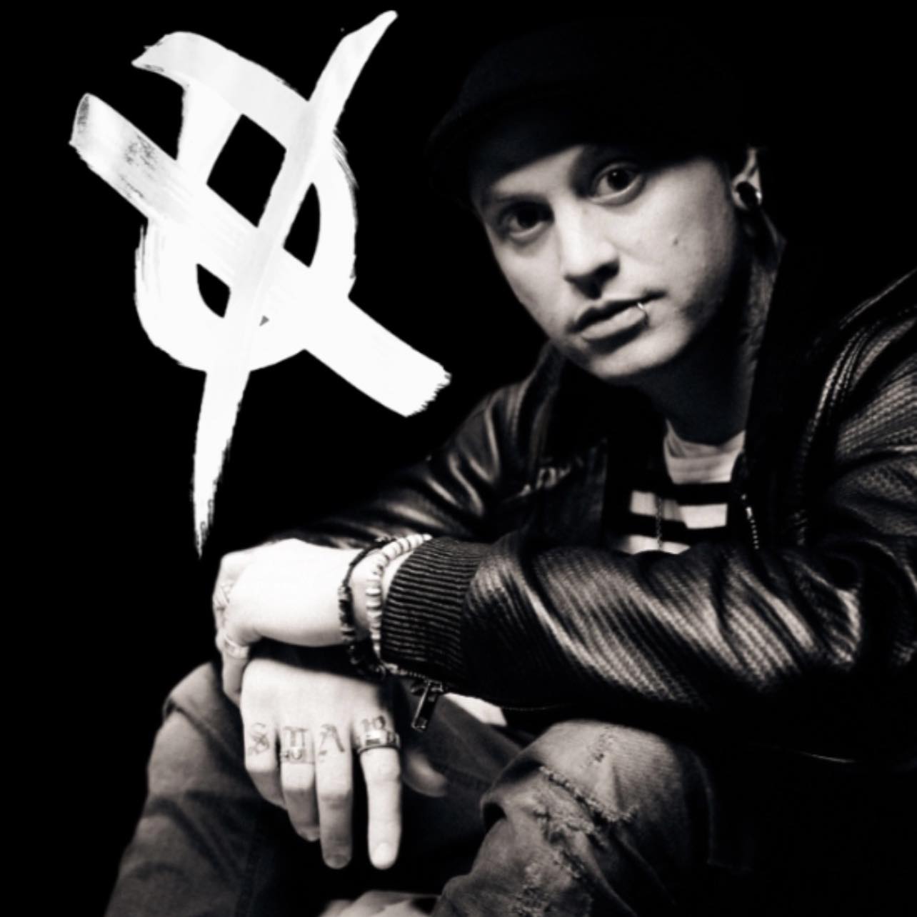 man wearing blue polo shirt with building background