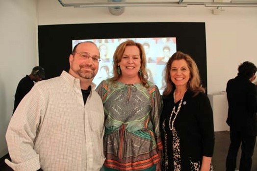 portrait of two women and a man