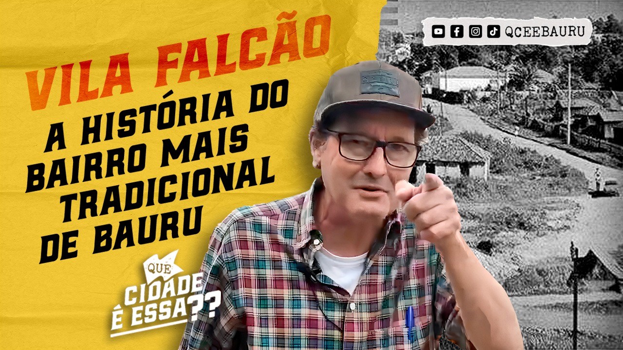 person in gray hoodie holding red and white box