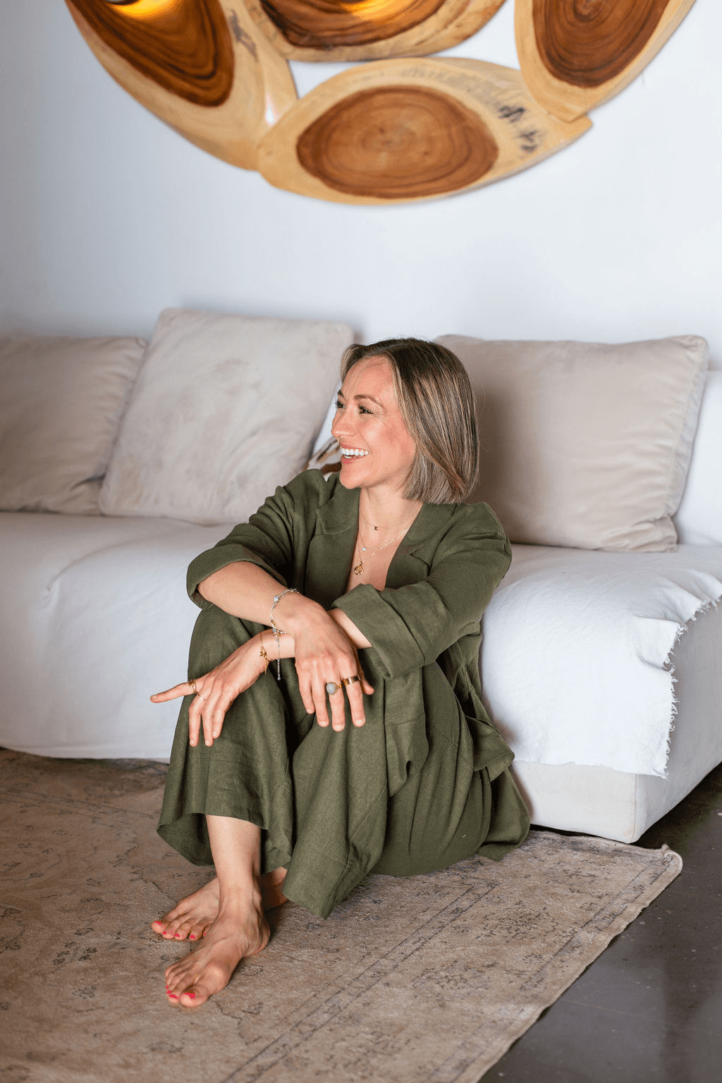 man with glasses smiling fully 