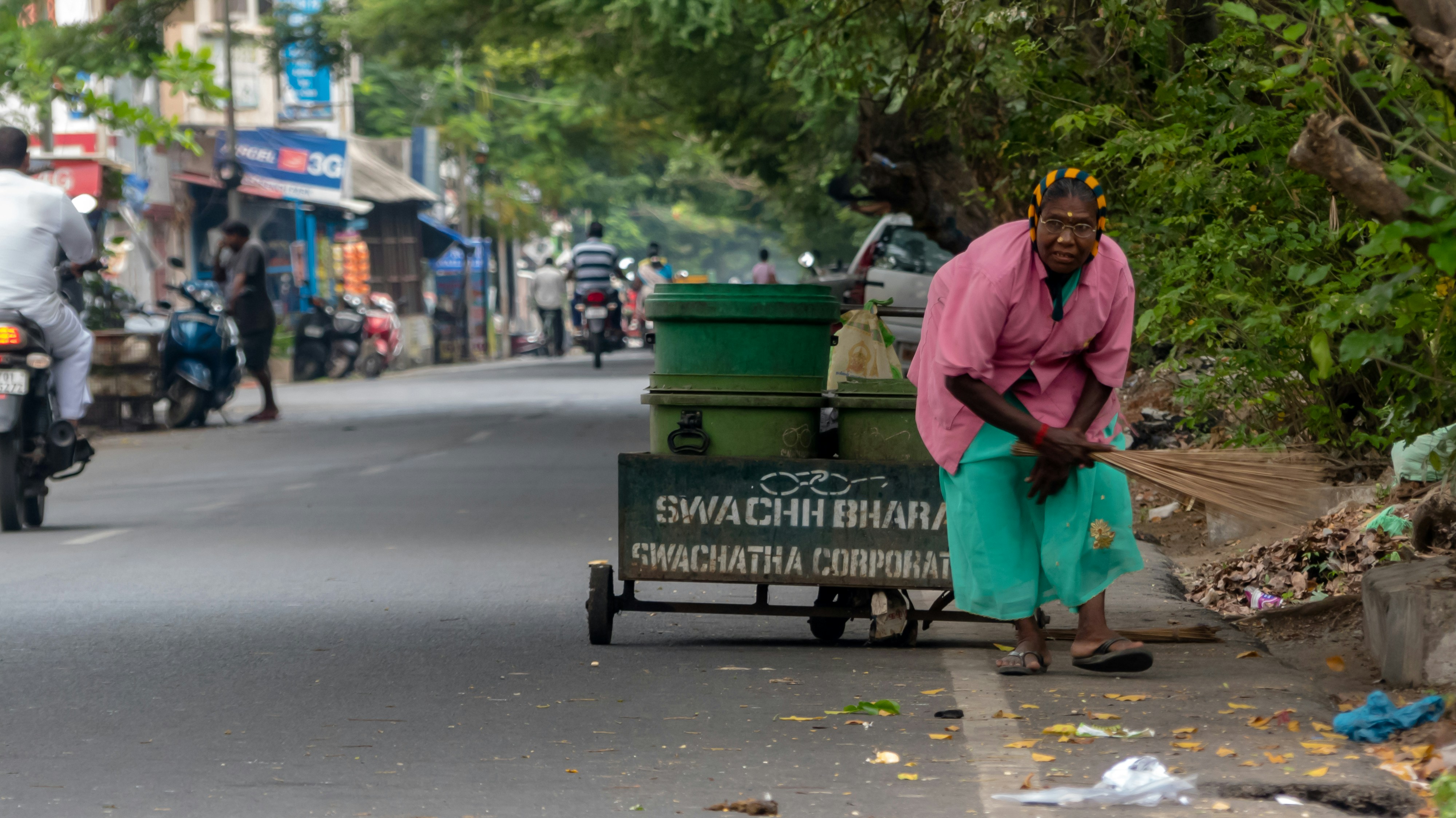 Woman collecting solid waste