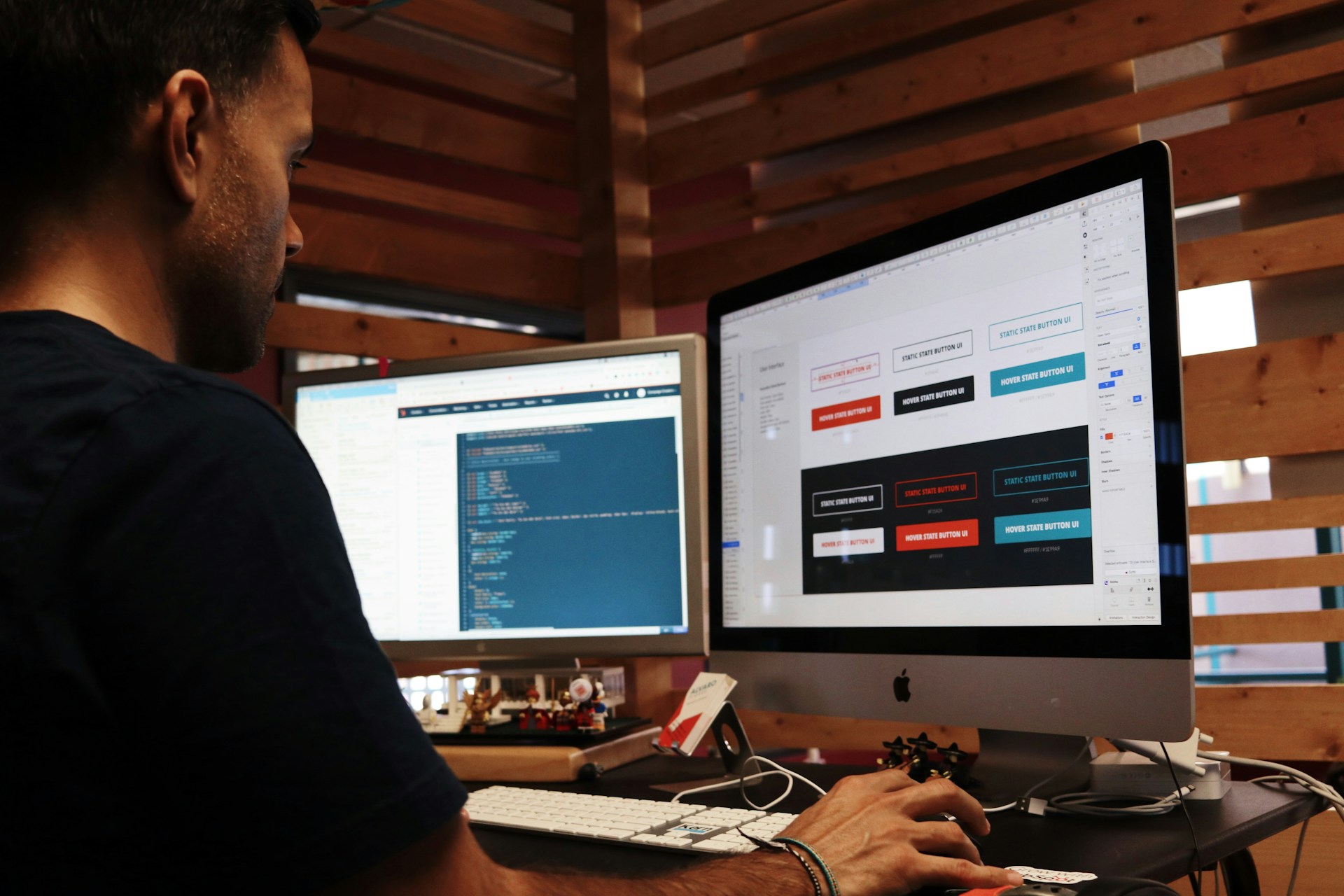 a man sitting behind a pc designing a website