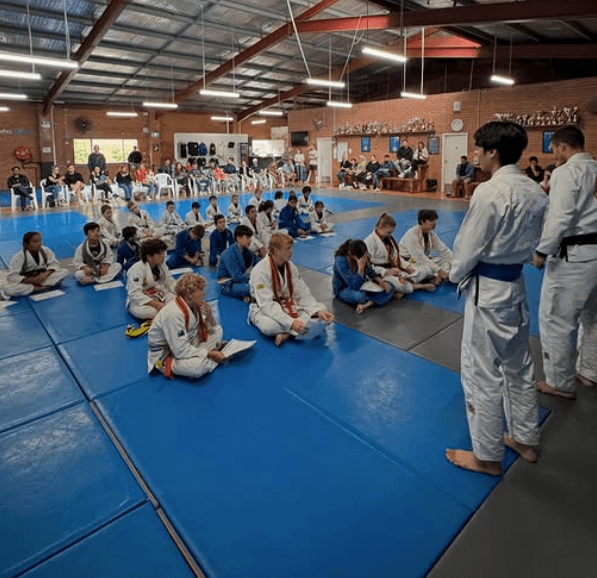 Students standing in a row during a group Jiu Jitsu session