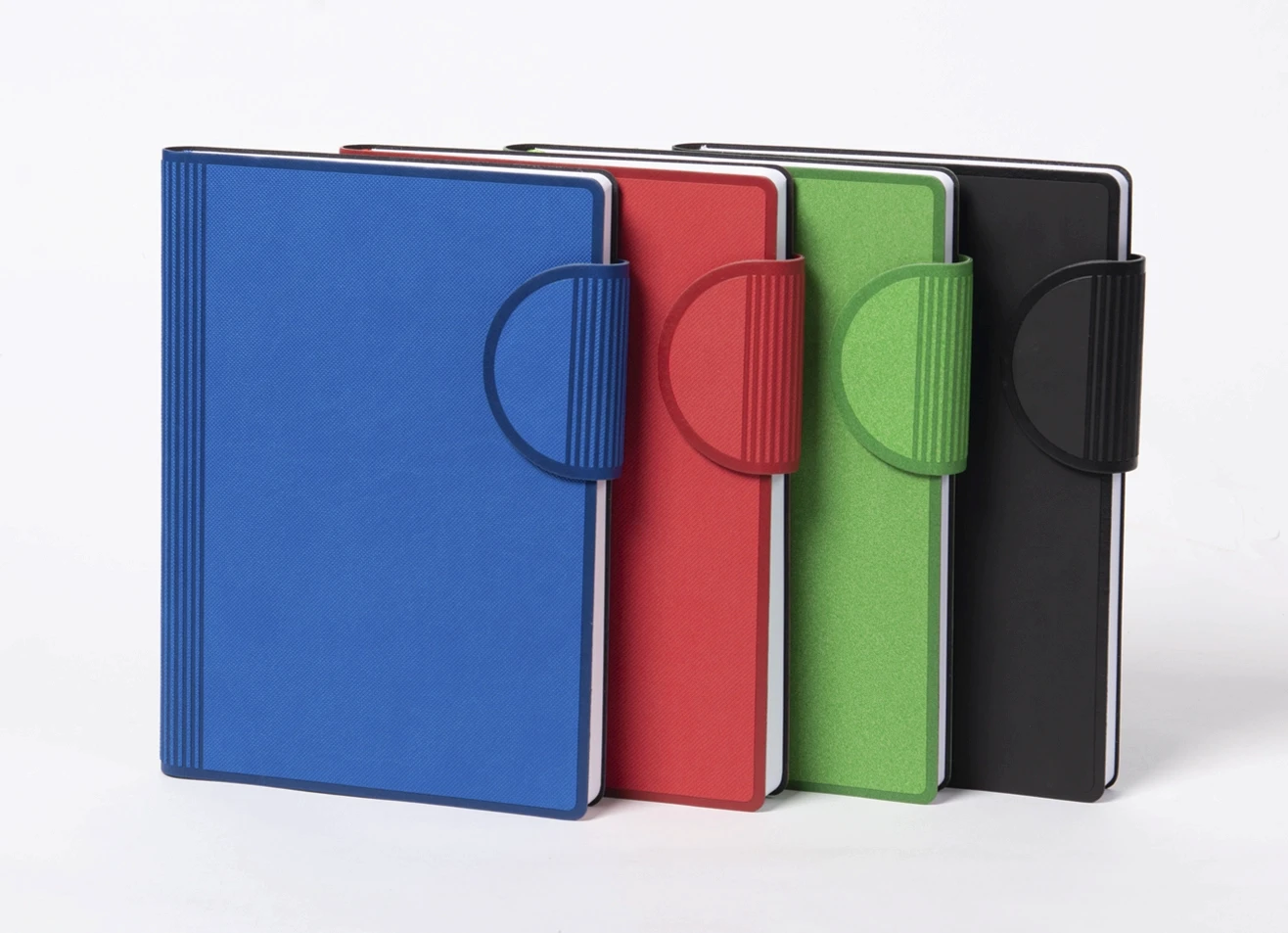 Set of strap closure journals in blue, red, green, and black colors