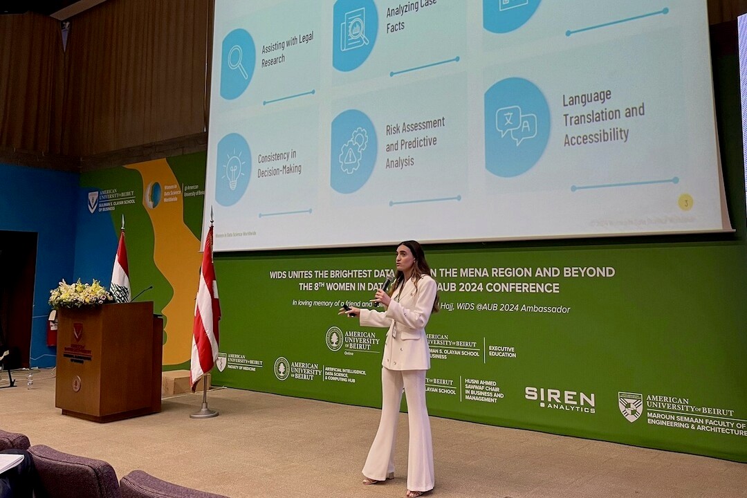 Nour Sibai, AI engineer at Siren, presenting at AUB's Women in Data Science conference on the use of LLMs and legal chatbots to address legal bias.