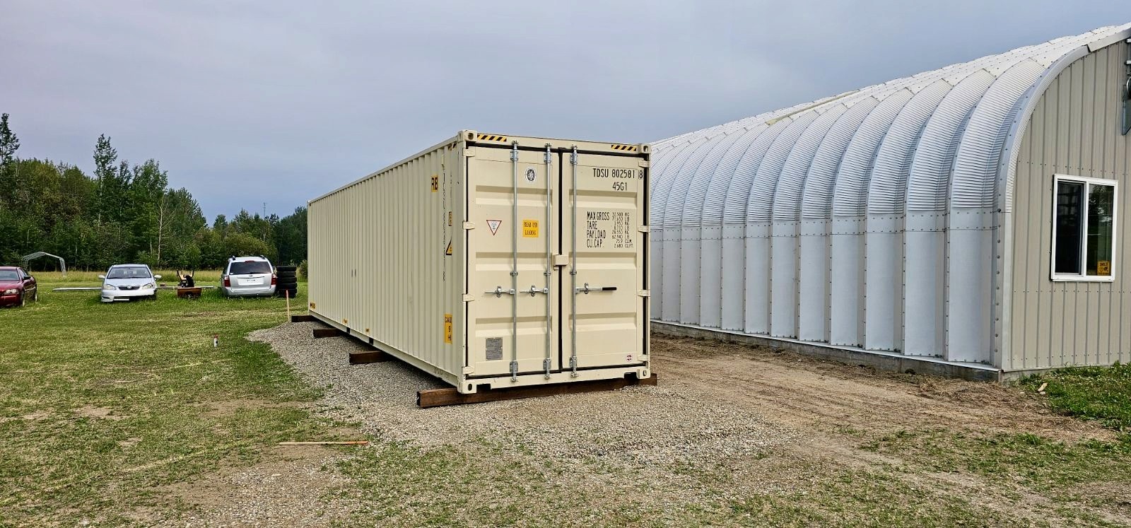 New 40-foot beige high cube container delivered to a farm