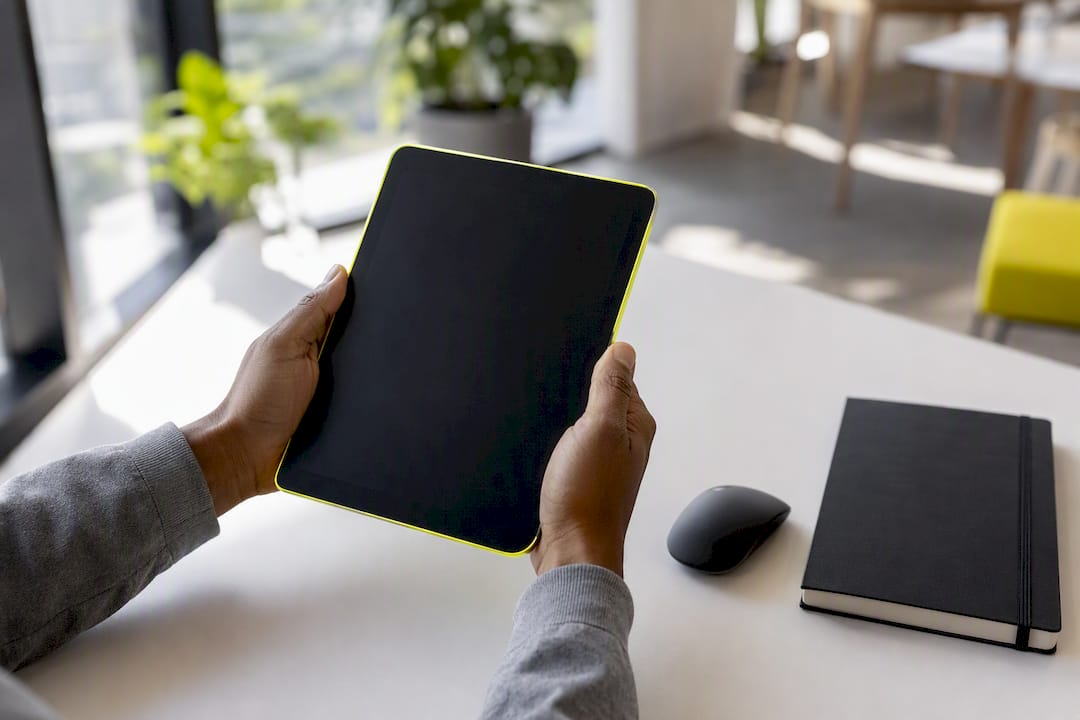 Hands capturing data entry on tablet