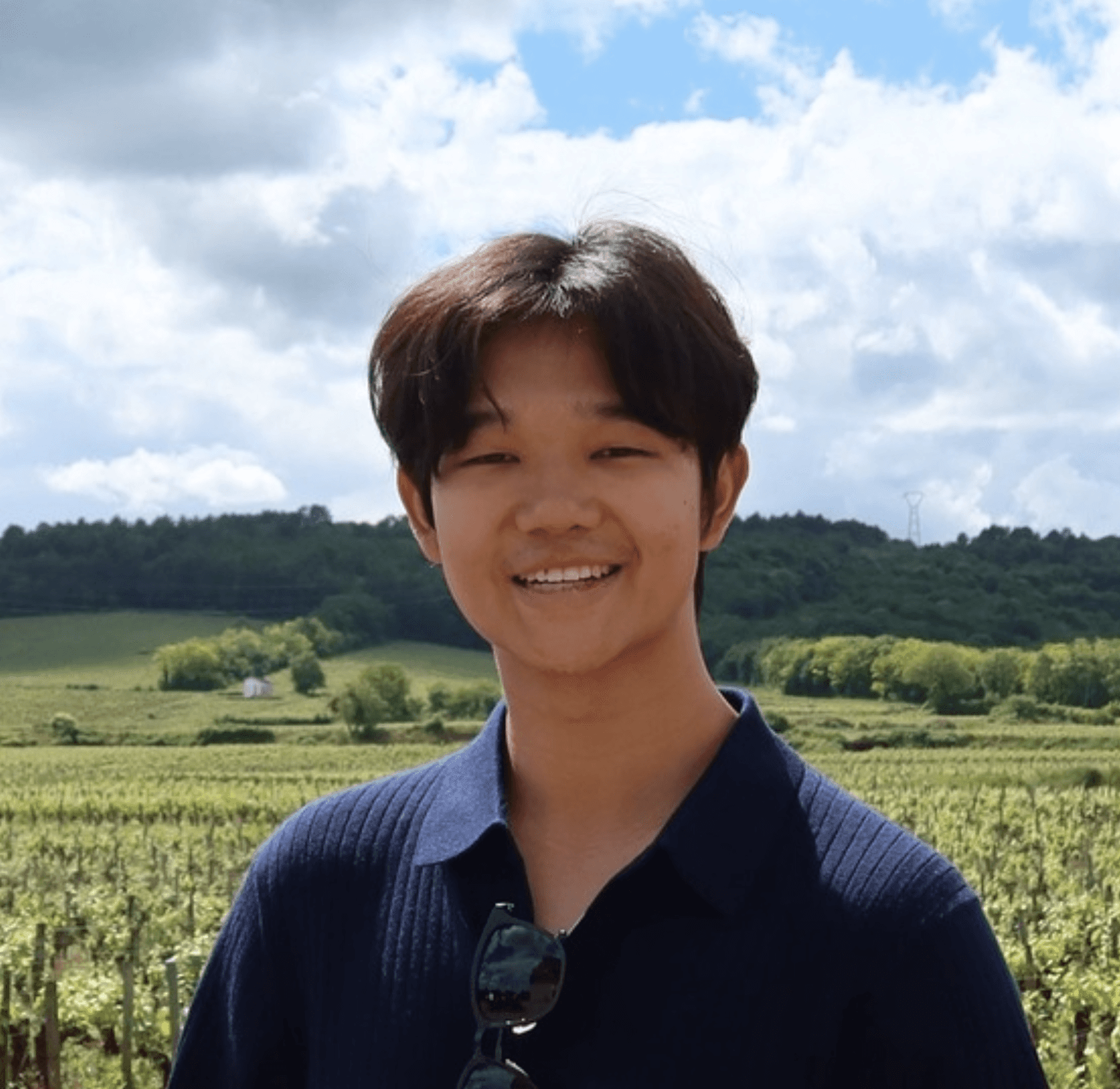 a man with a goatee smiles at the camera