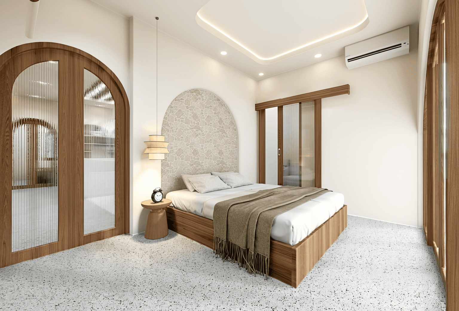 Arched stone headboard and terrazzo flooring in an Ungasan I bedroom suite, perfect for Bali home buyers.