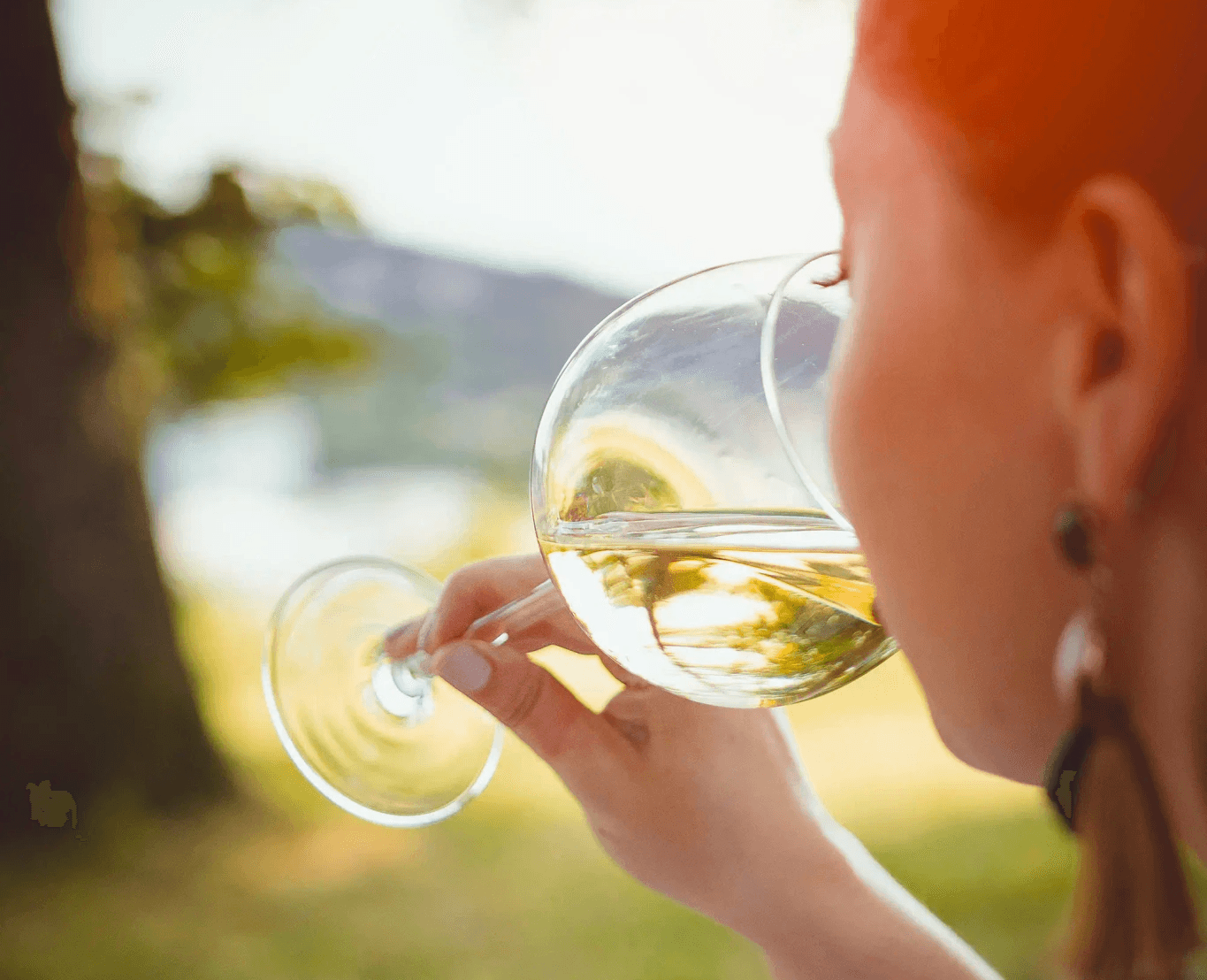 boy in white crew neck shirt holding clear glass bubble maker