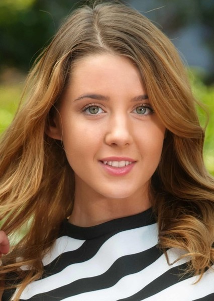 kids lying on a glass land and smiling