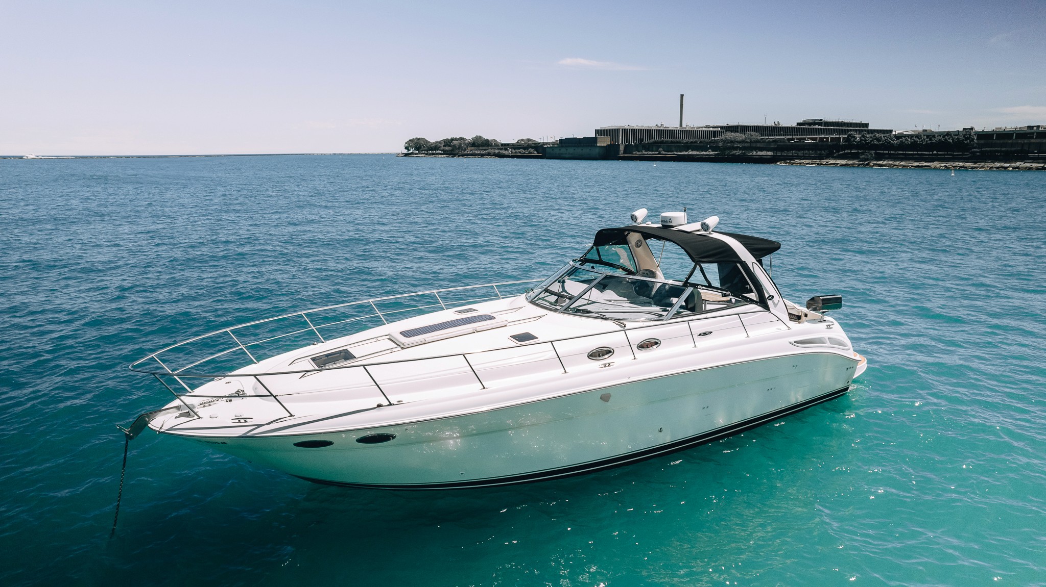 Luxury yacht exterior at dock in warm evening light