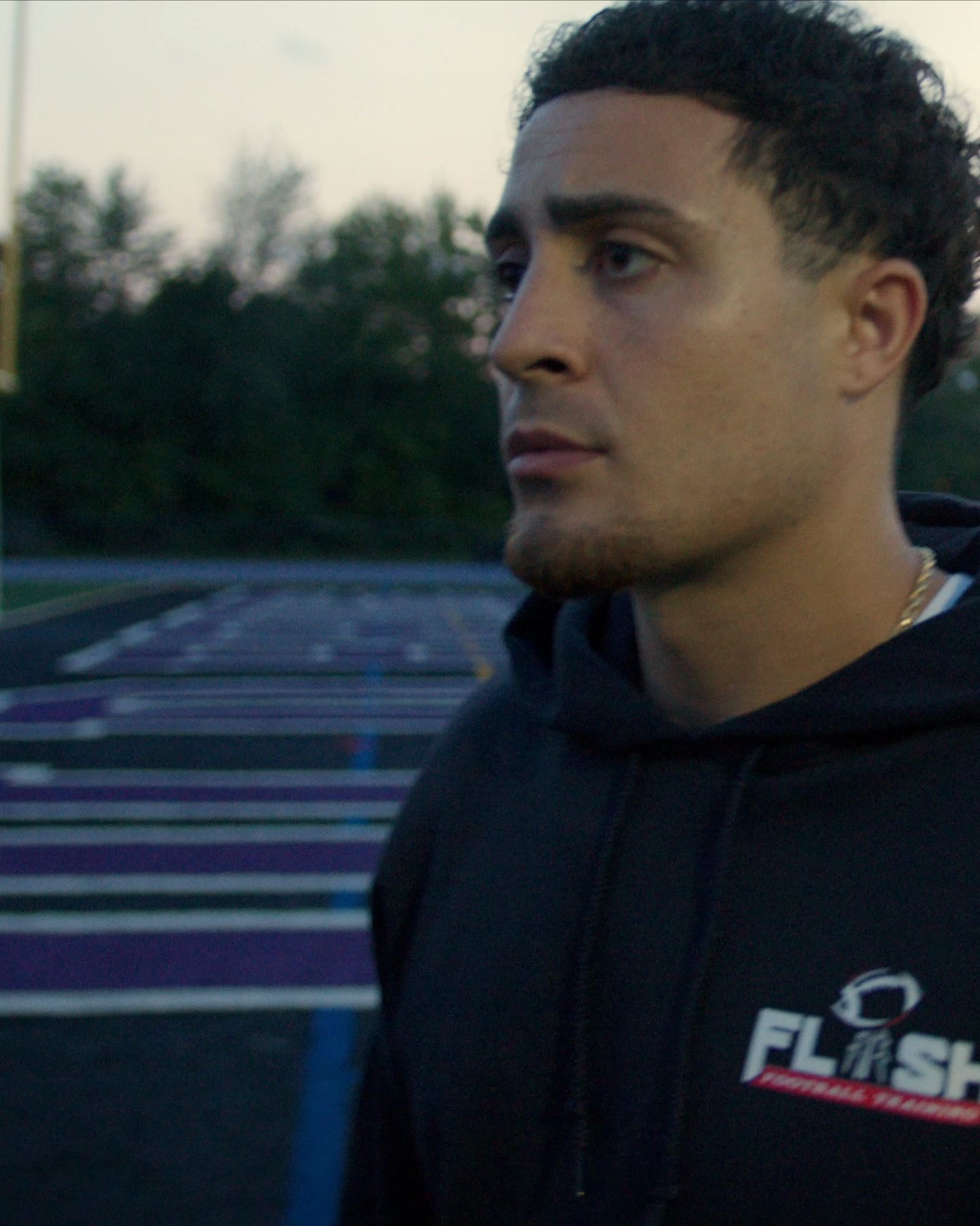 Portrait on a football field at dusk