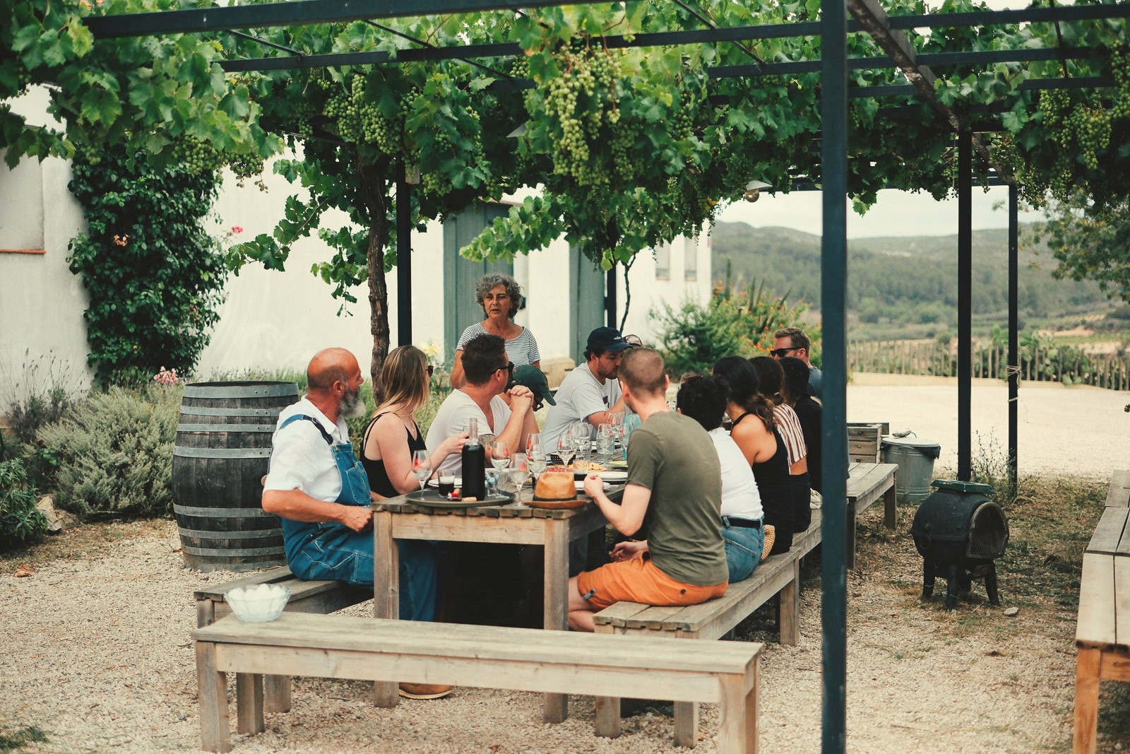 person holding green glass bottle