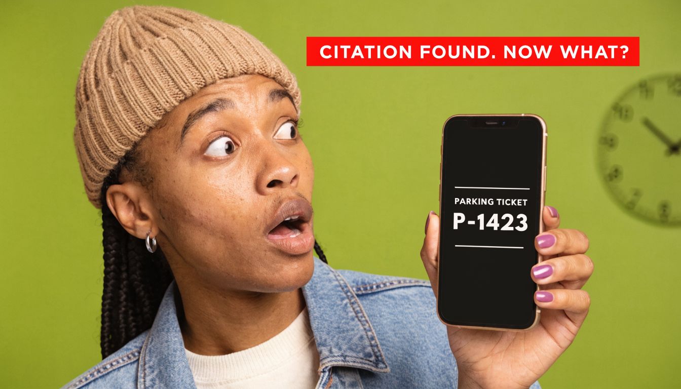 A surprised young person looking at a parking ticket number displayed on their smartphone screen.