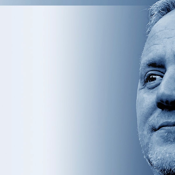 Grayscale close-up portrait of Jeremy J. McLean, Senior UX, Visual, and Motion Designer, featured in hero banner with gradient blue background.