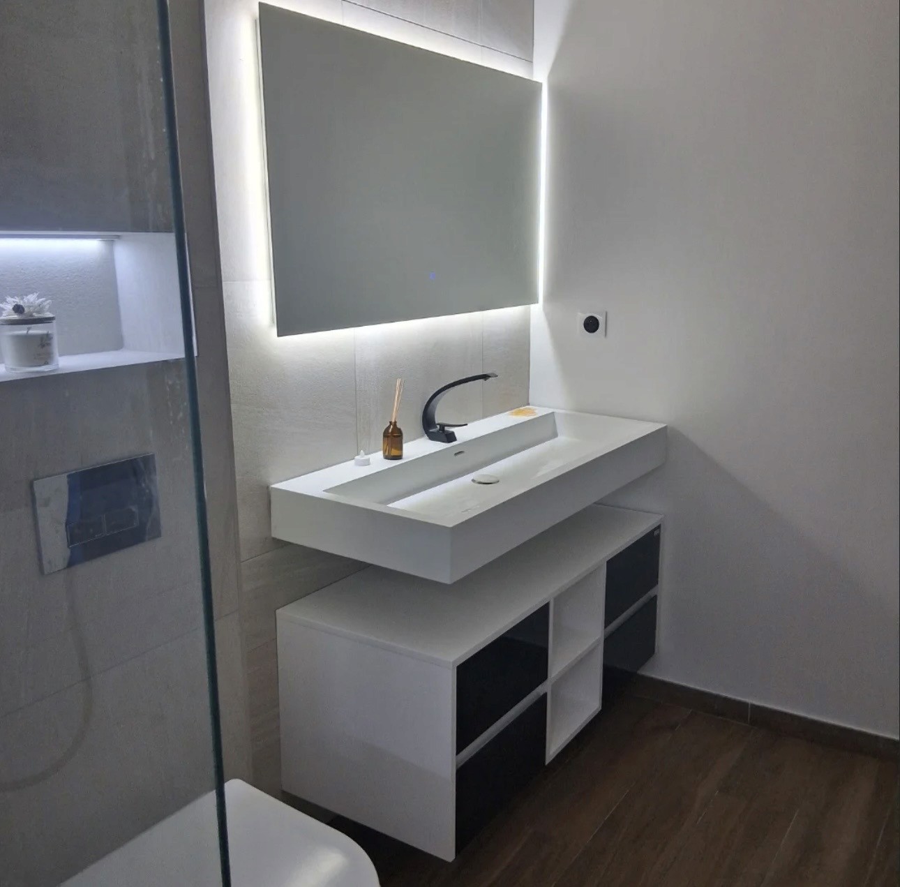 white ceramic bathtub near green potted plant