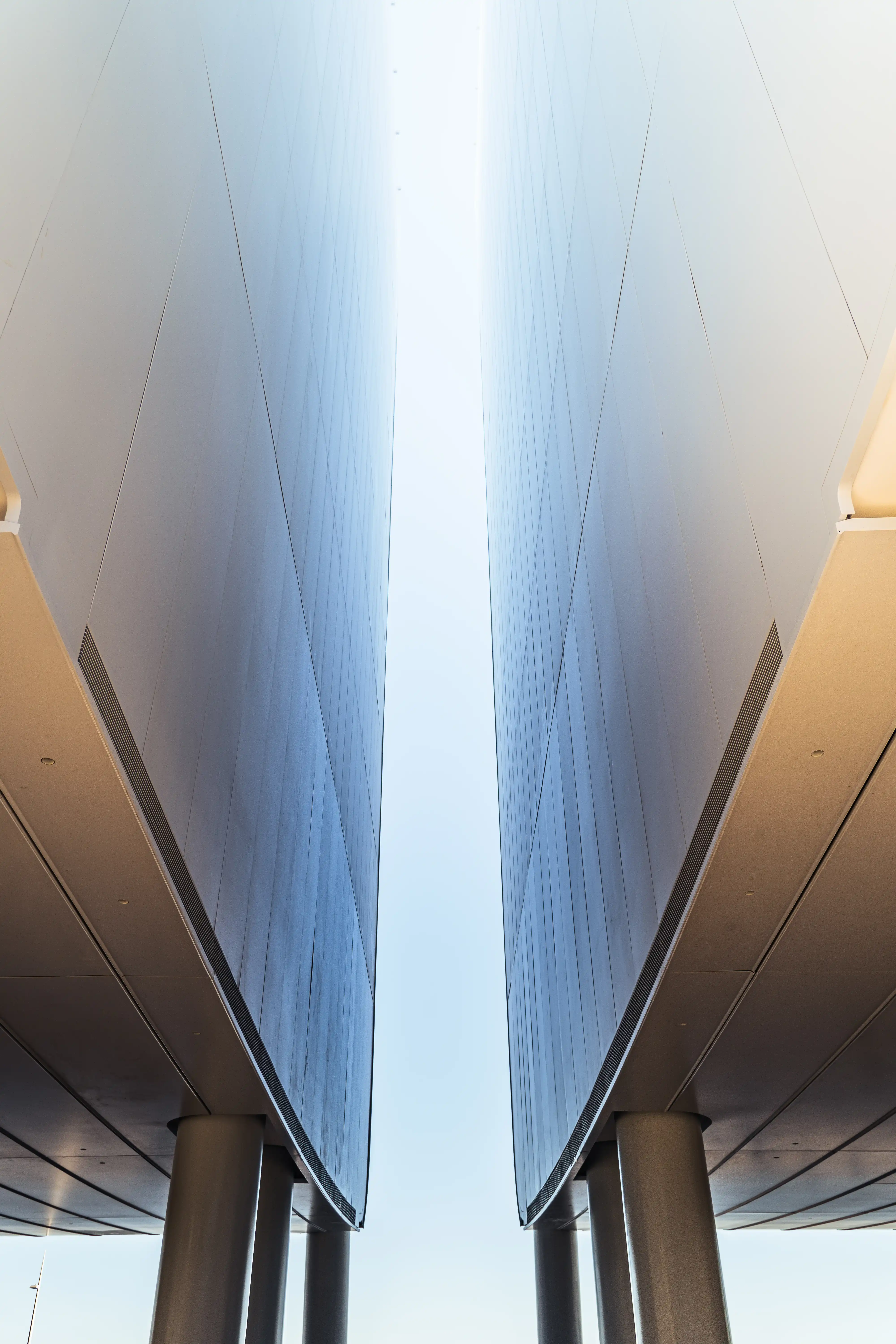 Silhouette of a person using a camera. Photographer taking photos with a professional DSLR camera in low light setting.