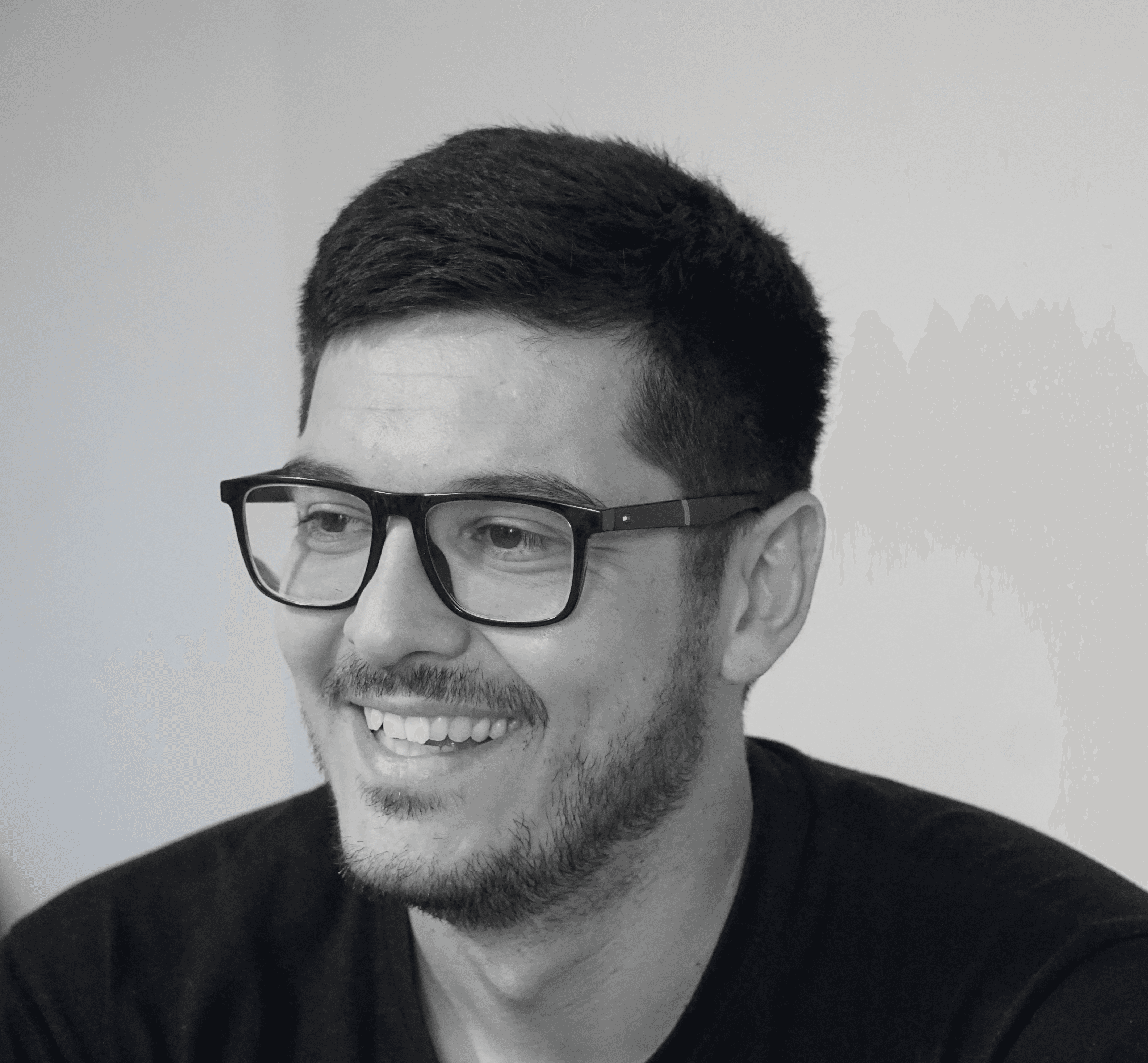 a blurry photo of a person standing in front of a wall