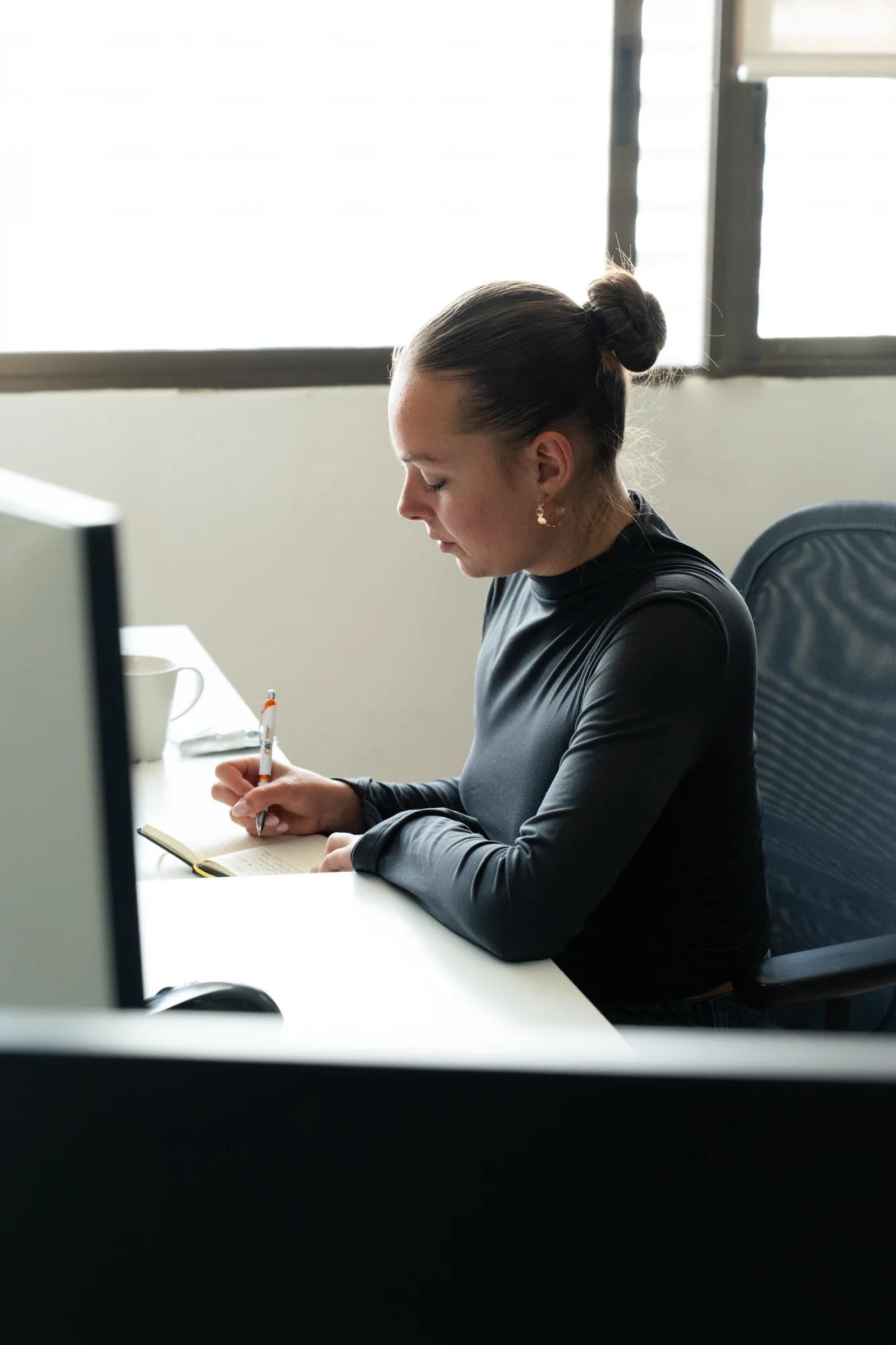 An employee of weWow working at the office in Valencia
