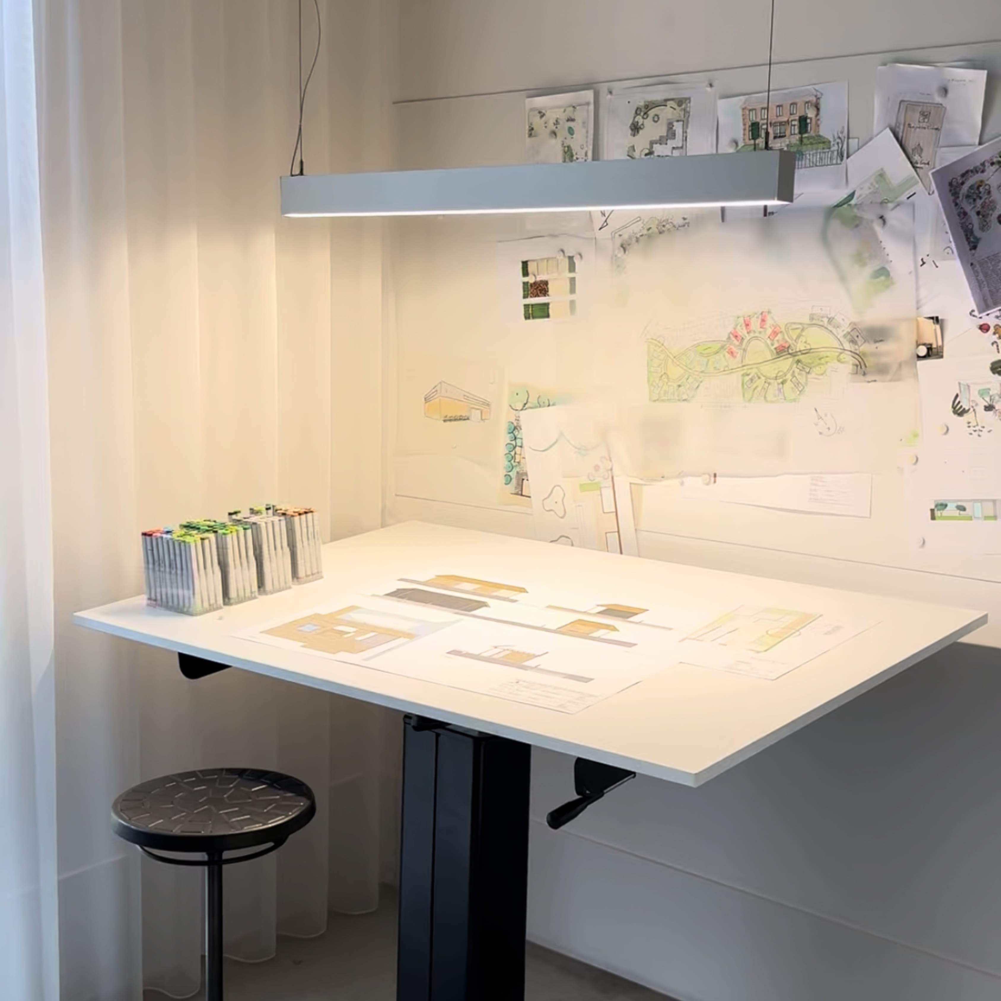 Modern bathroom featuring wooden cabinetry, a bathtub, a sleek sink, and natural light from a window.