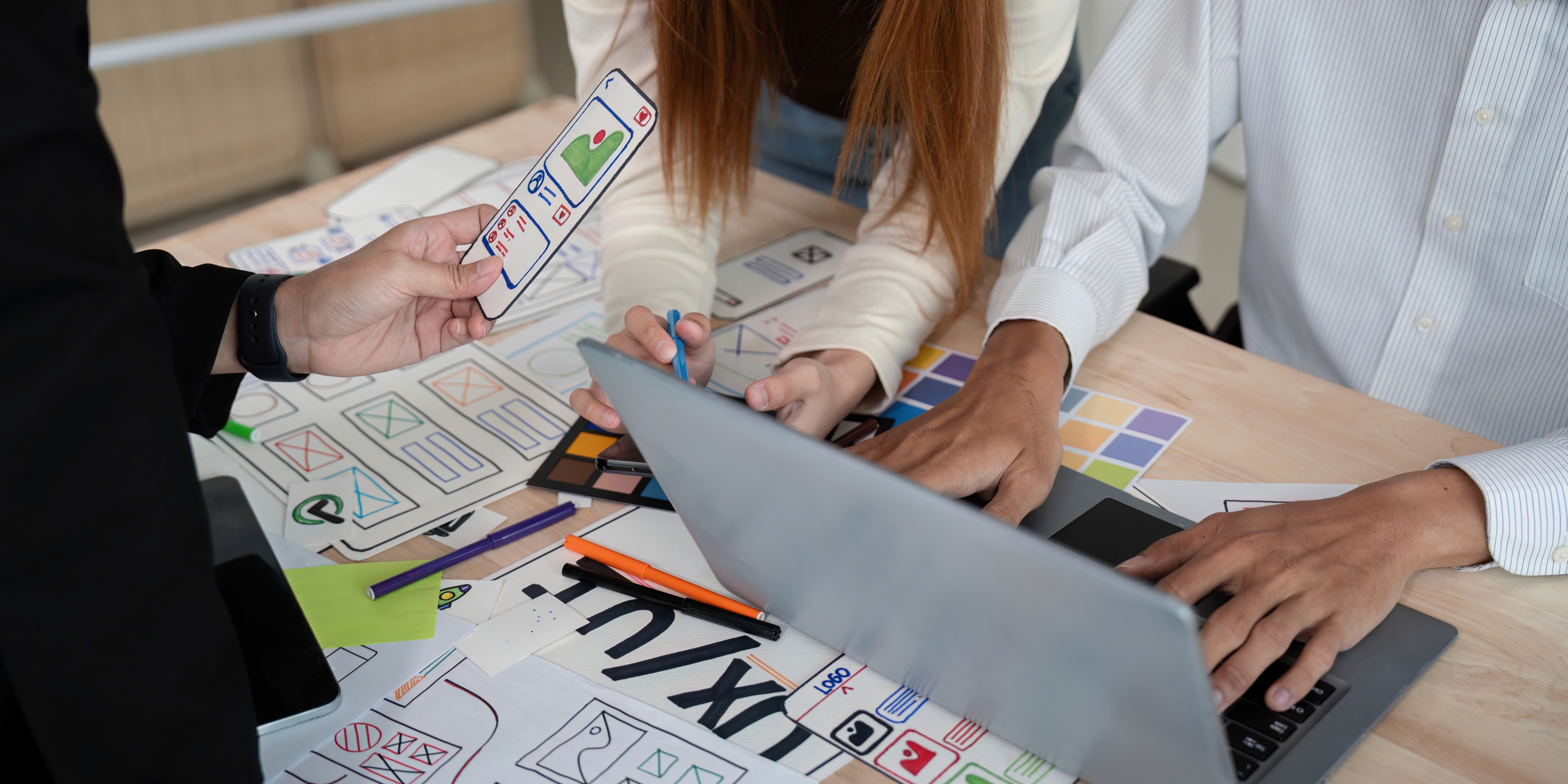 Image of a Team collaborating on a website design presentation