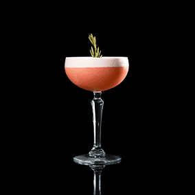 A closeup of a Pomegranate Whip drink against a dark background.