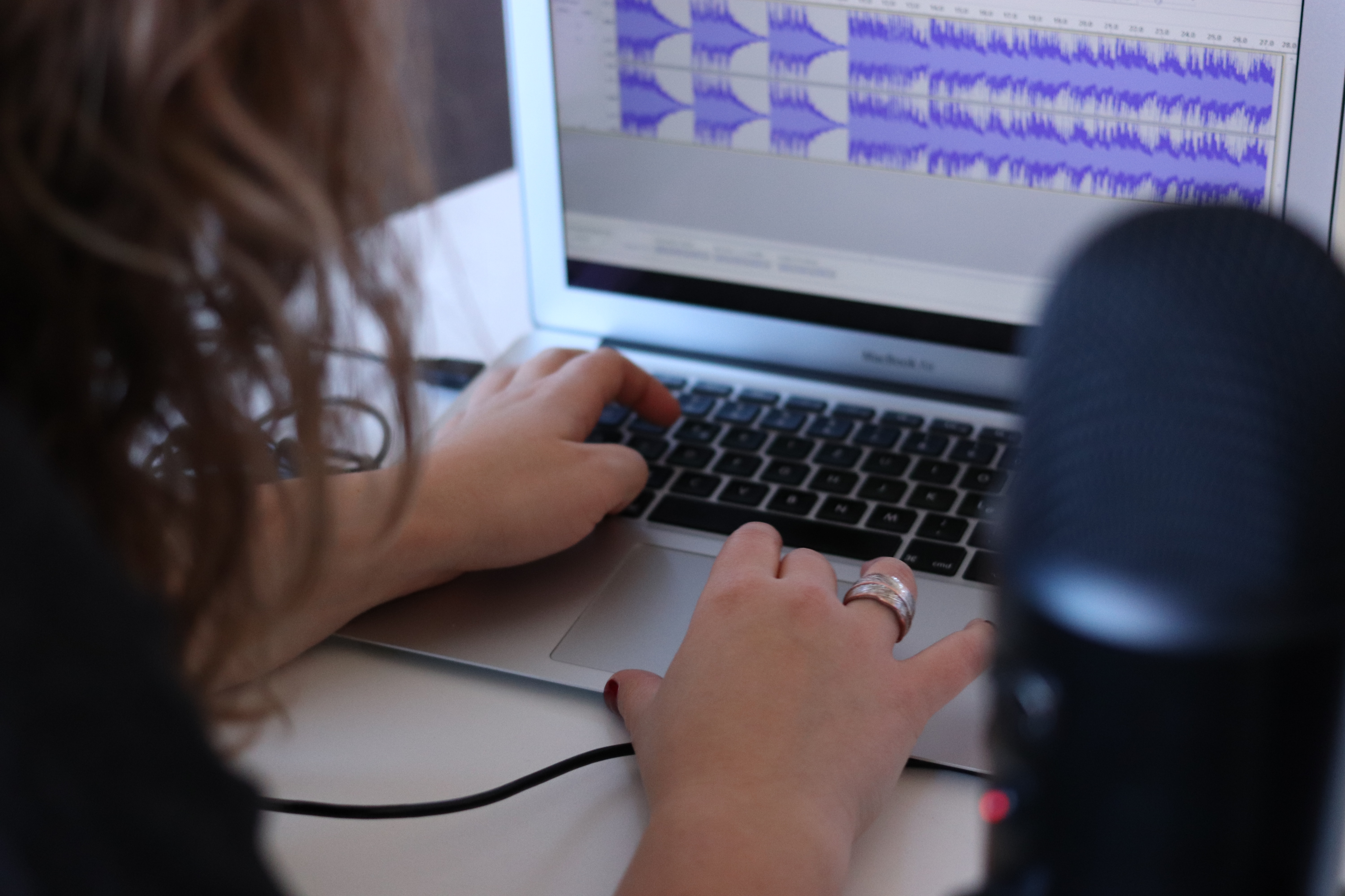Woman listening to her recording - female voice types