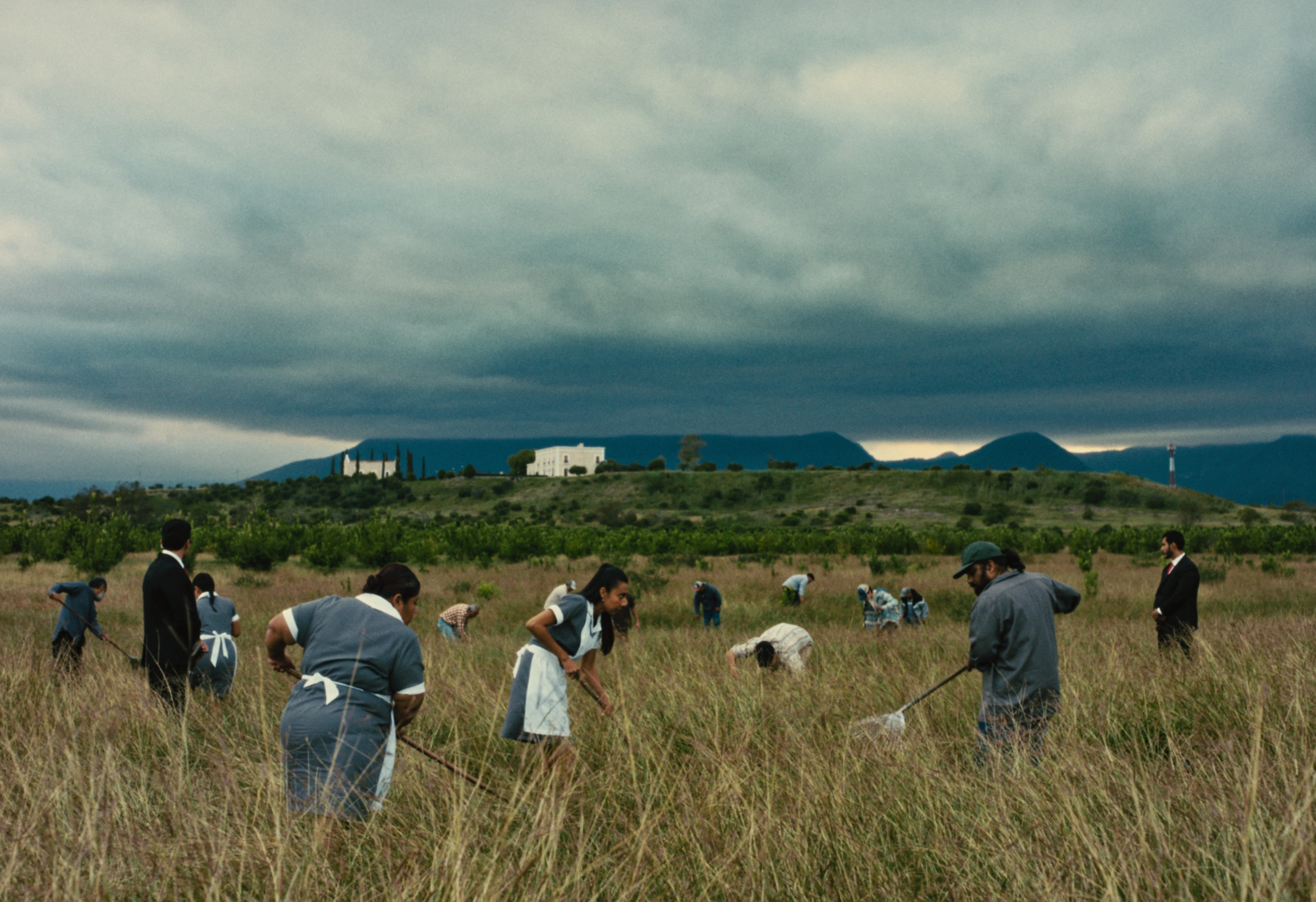 An orange cube-shaped side table is shown.