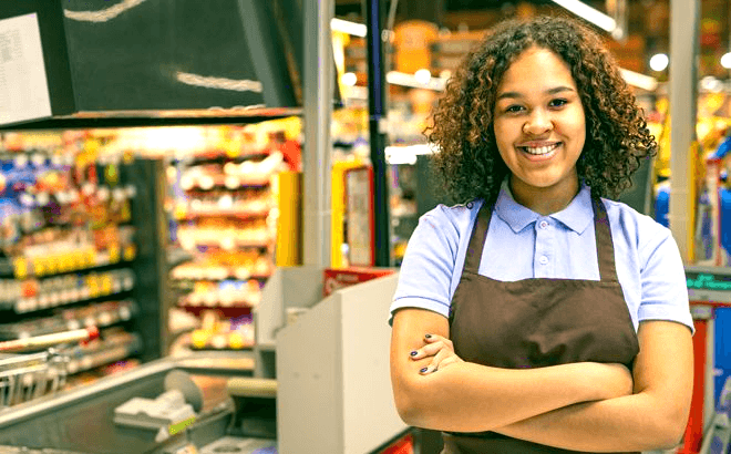 woman standing in a store while working in retail management
