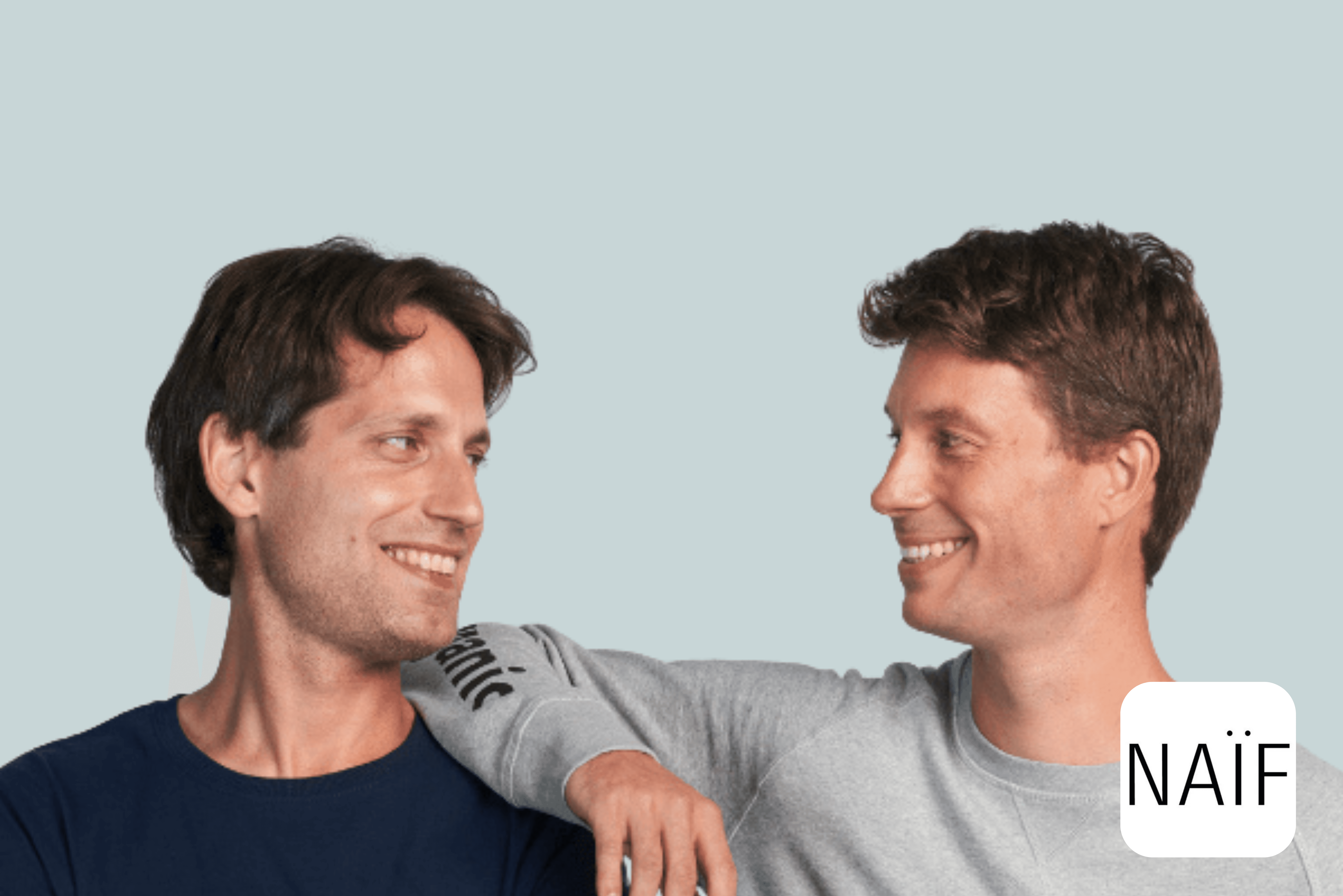 Naïf founders smiling together in a clean studio portrait
