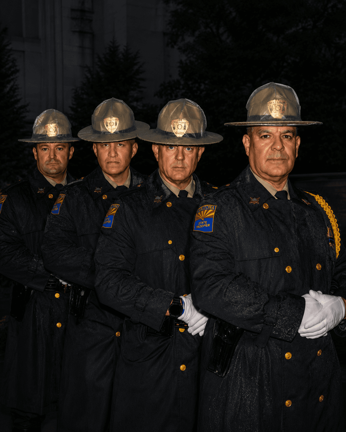 officers standing in rain