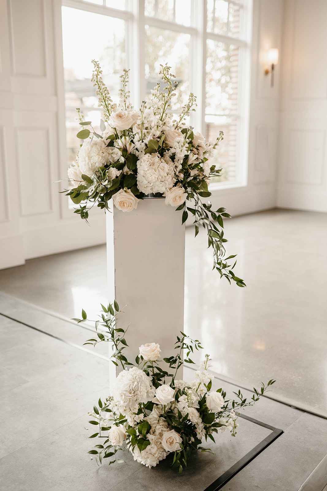 Monochromatic white wedding floral arrangements, designed by Lavender Blue Floral in Iowa.