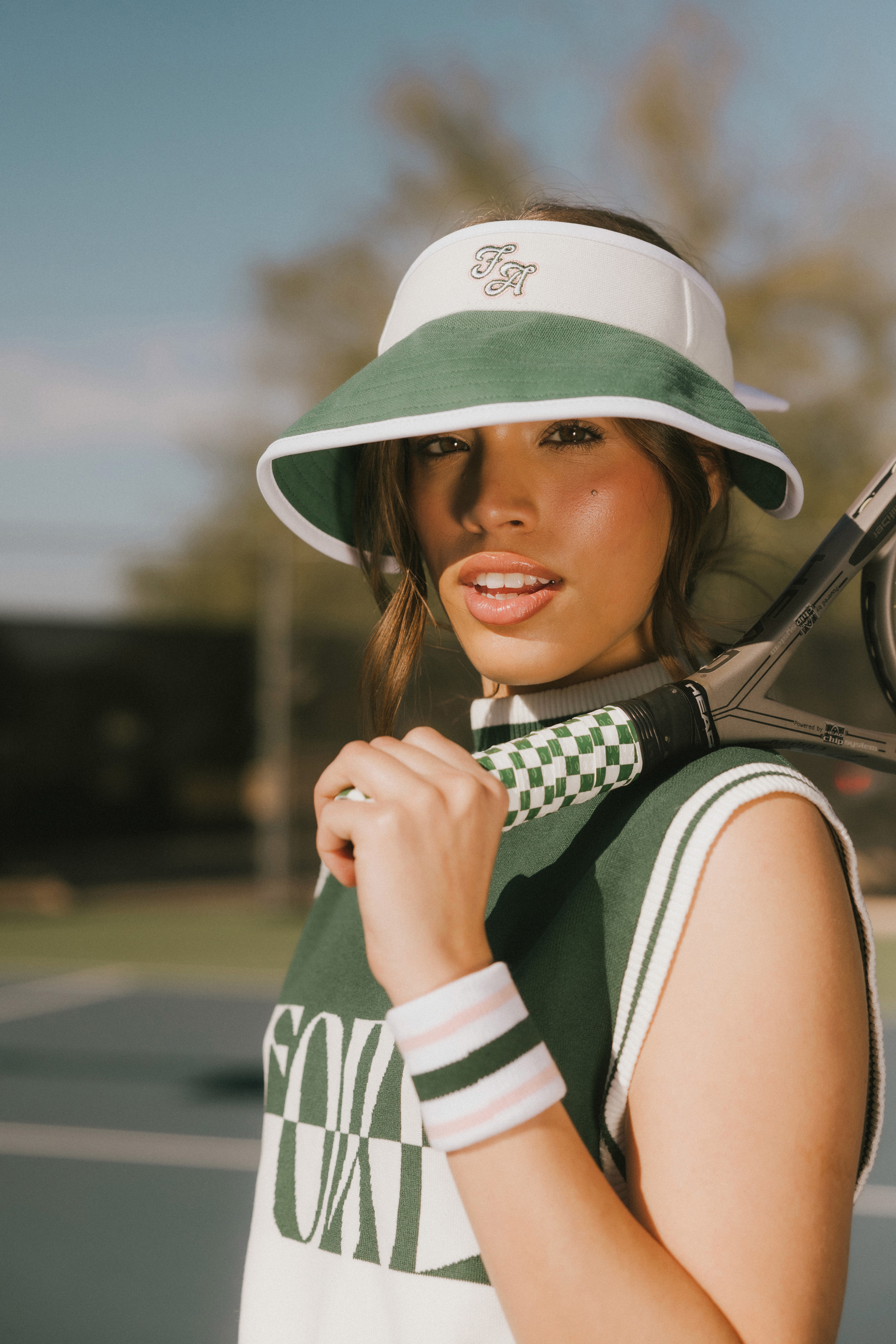 Woman wears a blue coat in a blue environment.