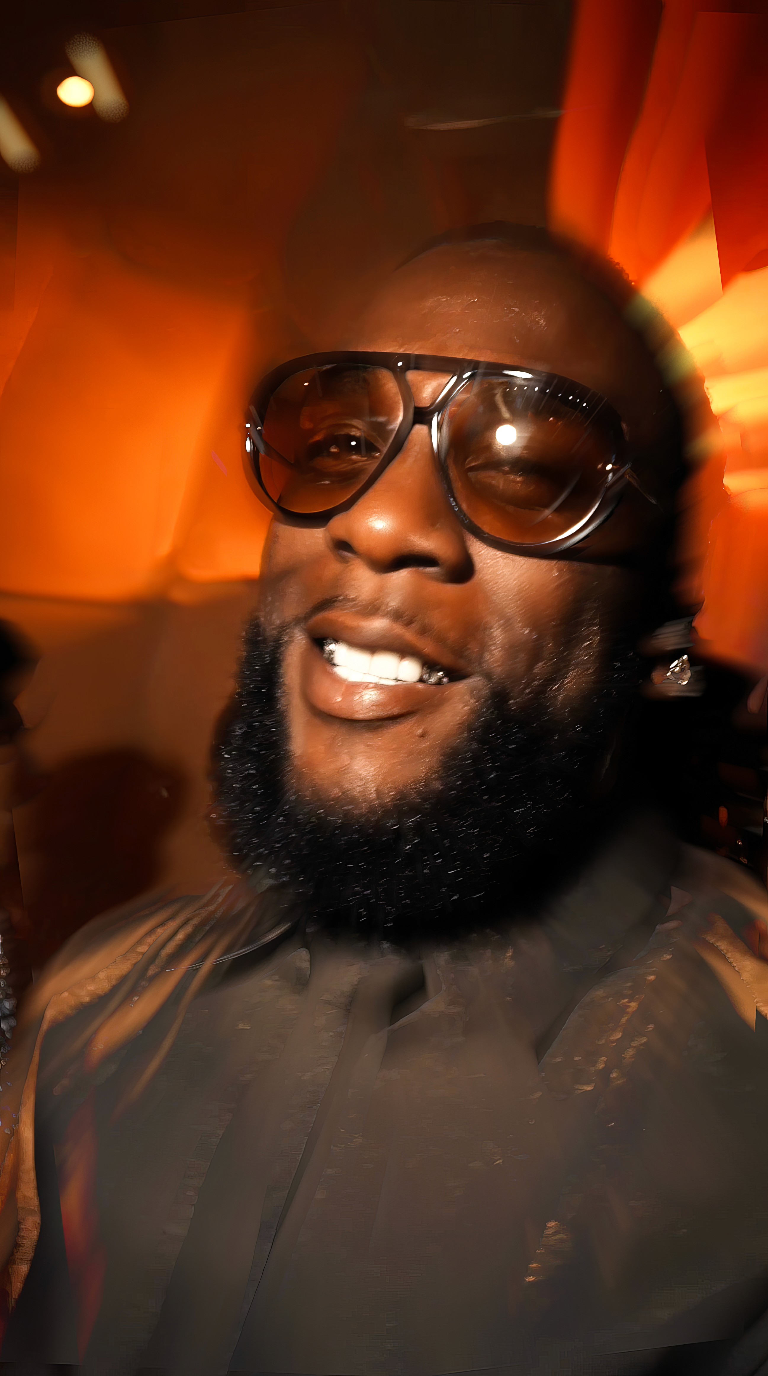 Woman in black outfit sitting on floor