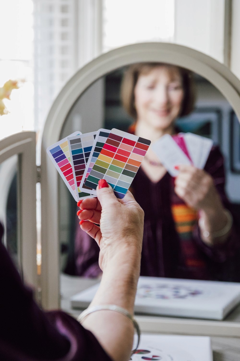 Izzy holding colour analysis cards