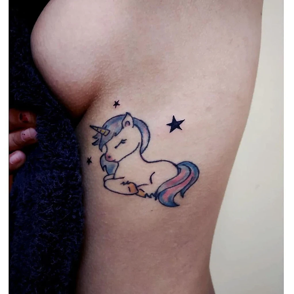 Old-fashioned unicorn thigh tattoo by a tattoo artist in Bangalore at Fred's tattoo studio in Bangalore, ranked among the best tattoo places in Bangalore.
