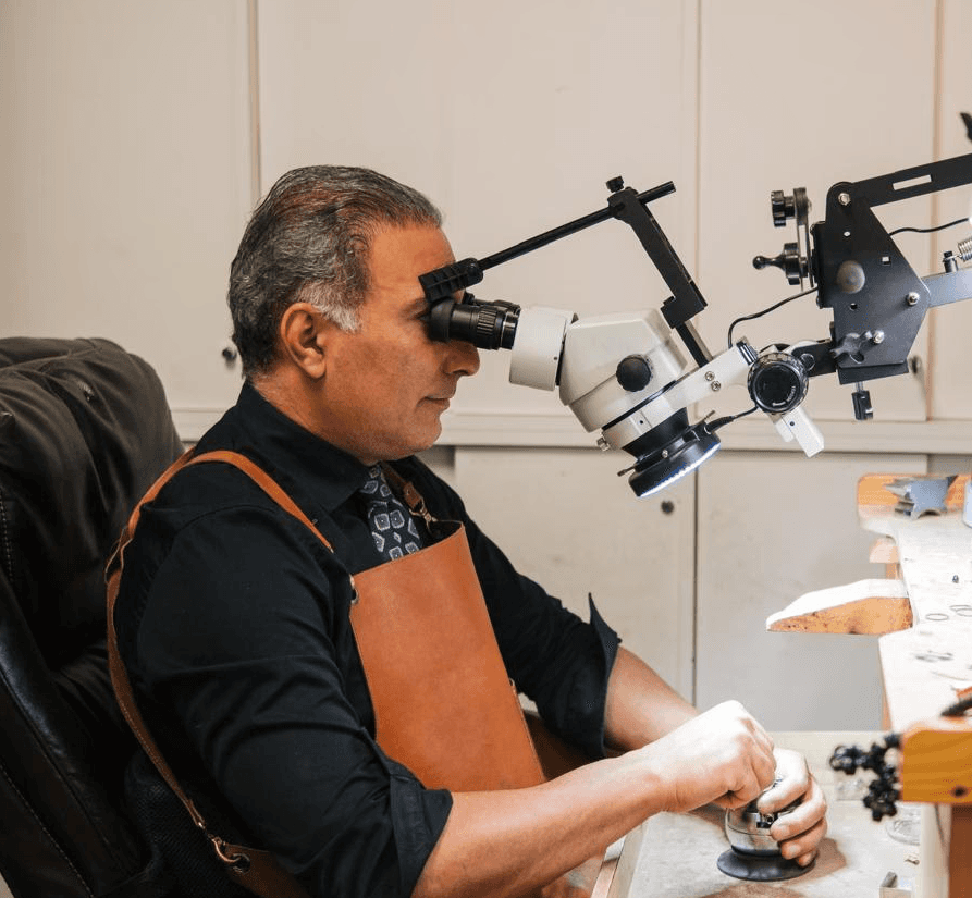 Master jeweler at Vanhess Jewelry Coquitlam handcrafting a custom engagement ring with precision — available in sapphire, emerald, and lab grown diamonds.