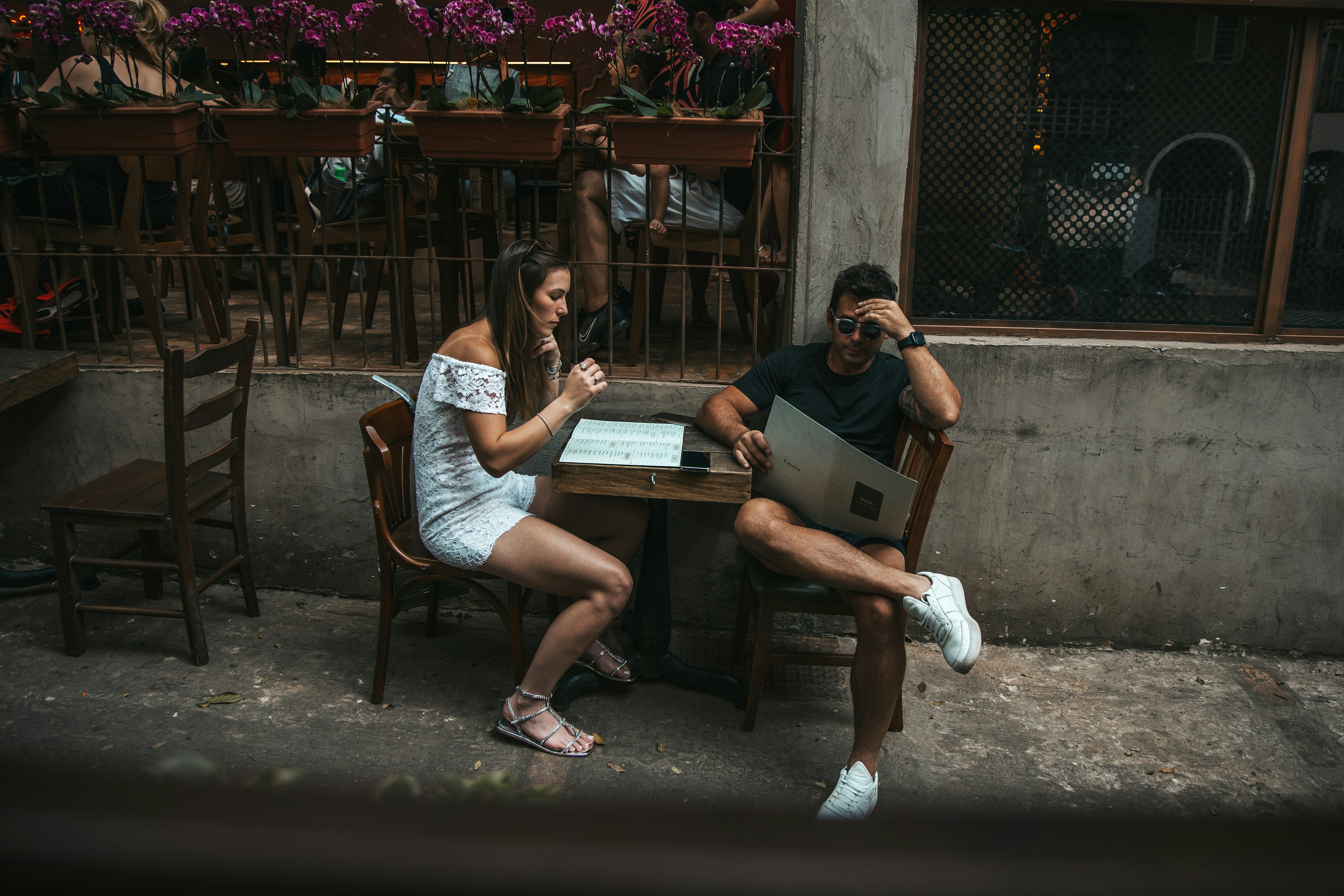 romantic lovers about to order at the restaurant