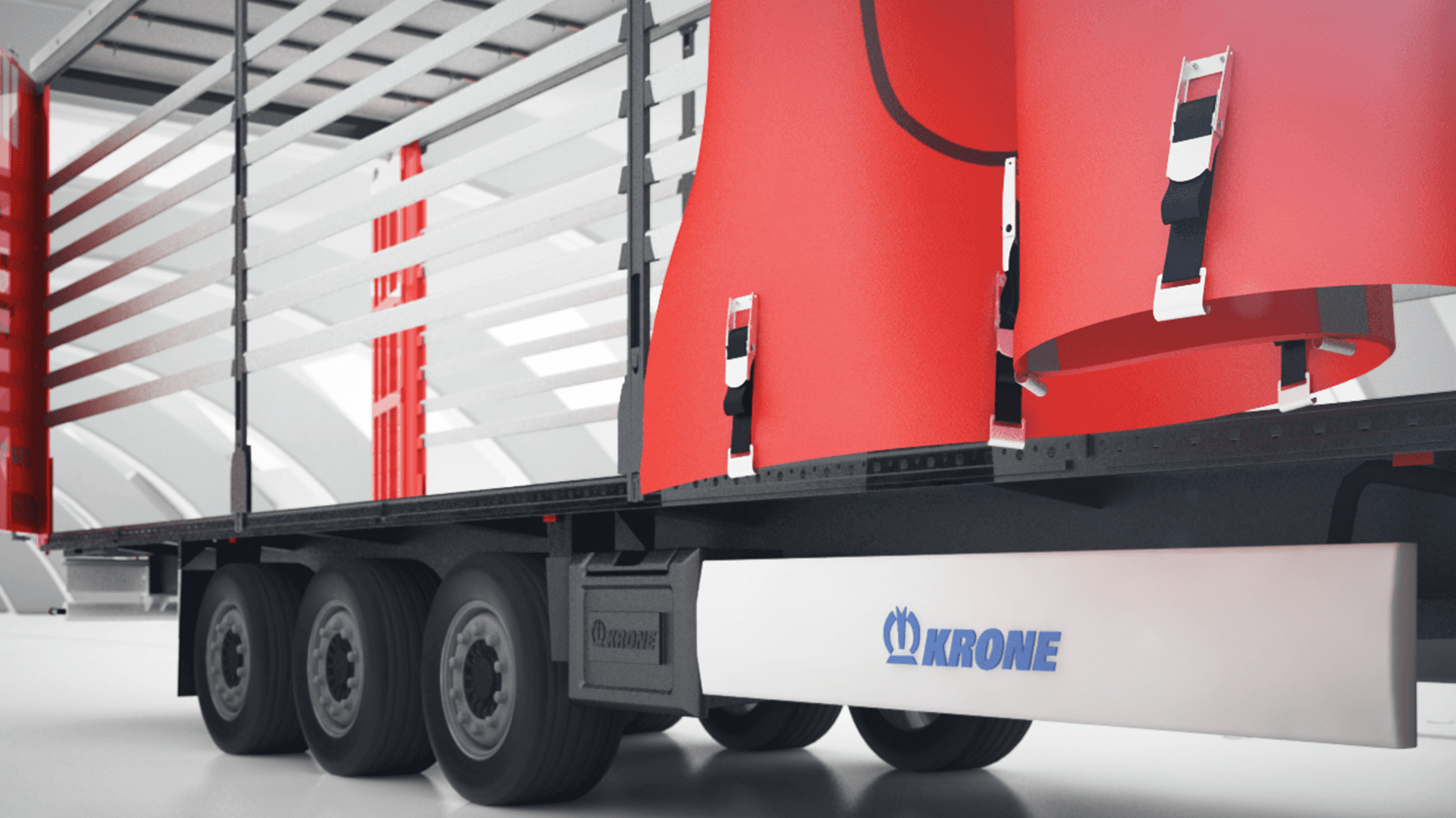 Zbliżenie na otwartą naczepę ciężarową marki Krone z rozsuniętą plandeką, ukazującą system załadunku i zabezpieczeń wewnątrz przestrzeni ładunkowej.