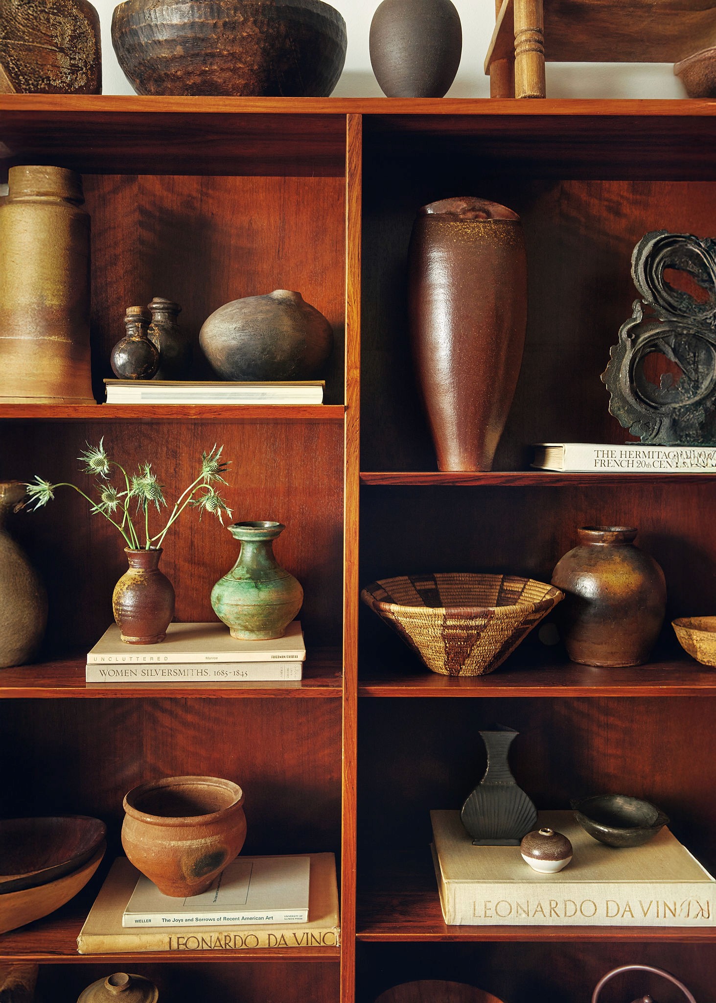 Woman with red hair covering mouth with hair