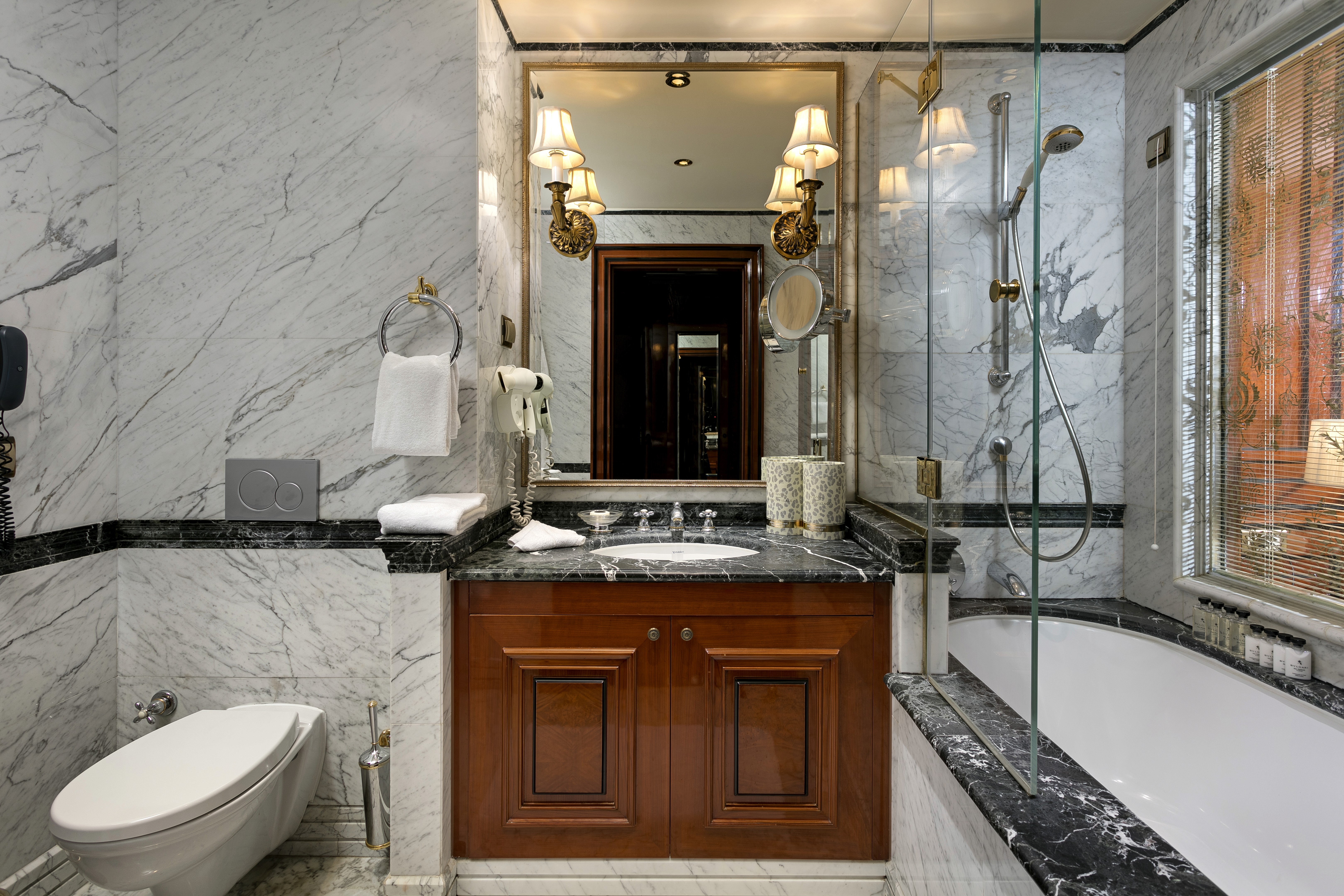 Inside, refined details like a pillow menu, bathrobe and slippers elevate rest into an experience.