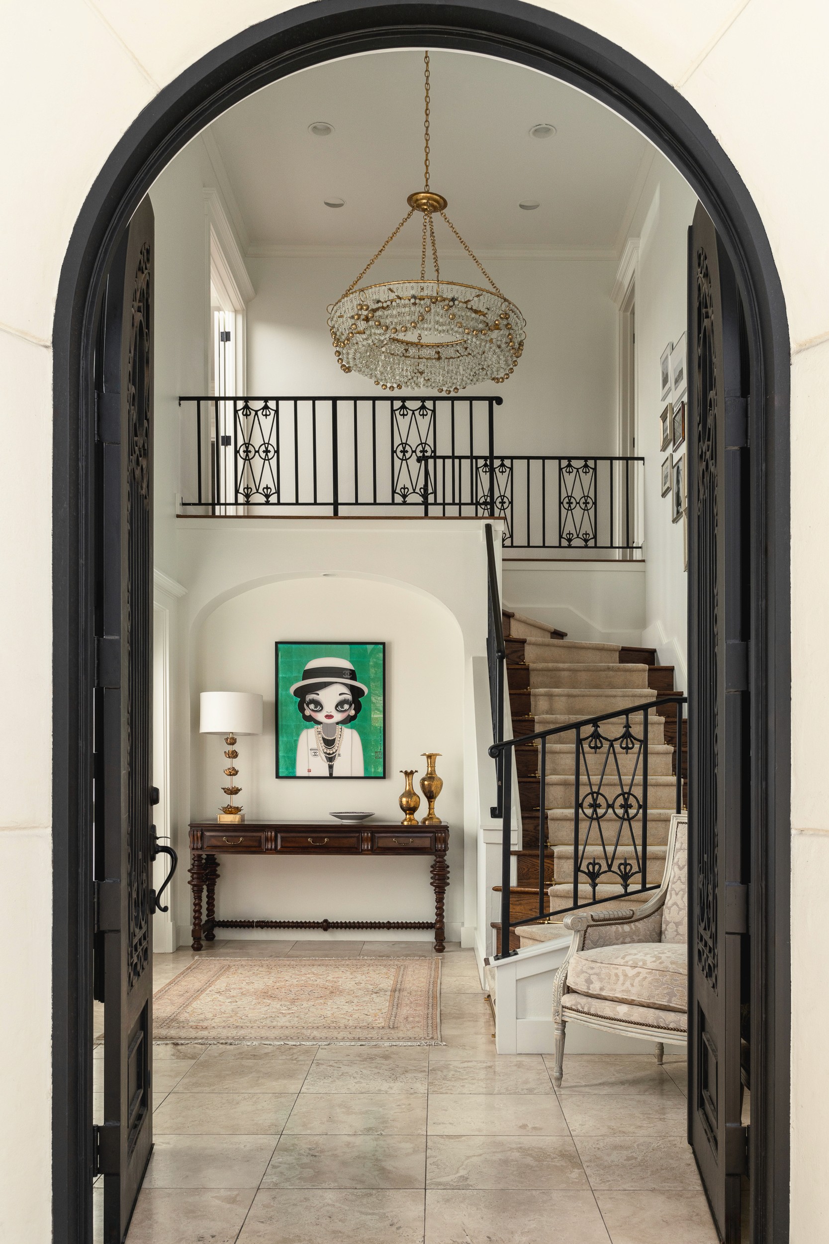 The home features traditional ironwork and classical styles alongside contemporary furnishings.