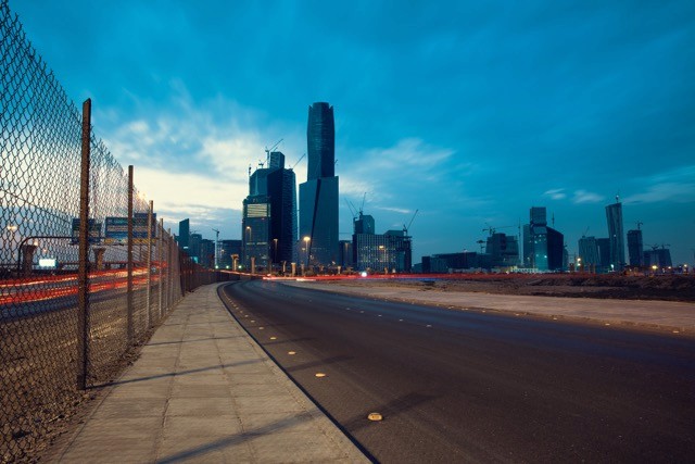 Twilight view of the modern King Abdullah Financial District in Riyadh, highlighting the dynamic and forward-thinking environment that mirrors SAA Law Firm's innovative legal approach.